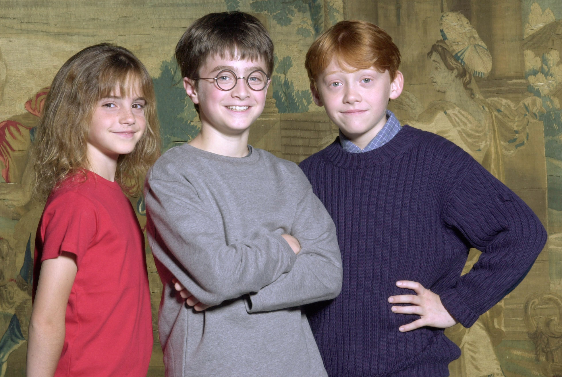 Daniel Radcliffe, au centre, a été désigné comme l'acteur qui incarnera Harry Potter, dans le prochain film, aux côtés de Rupert Grint, à droite, et d'Emma Watson, dans un post daté du 21 août 2000 | Source : Getty Images