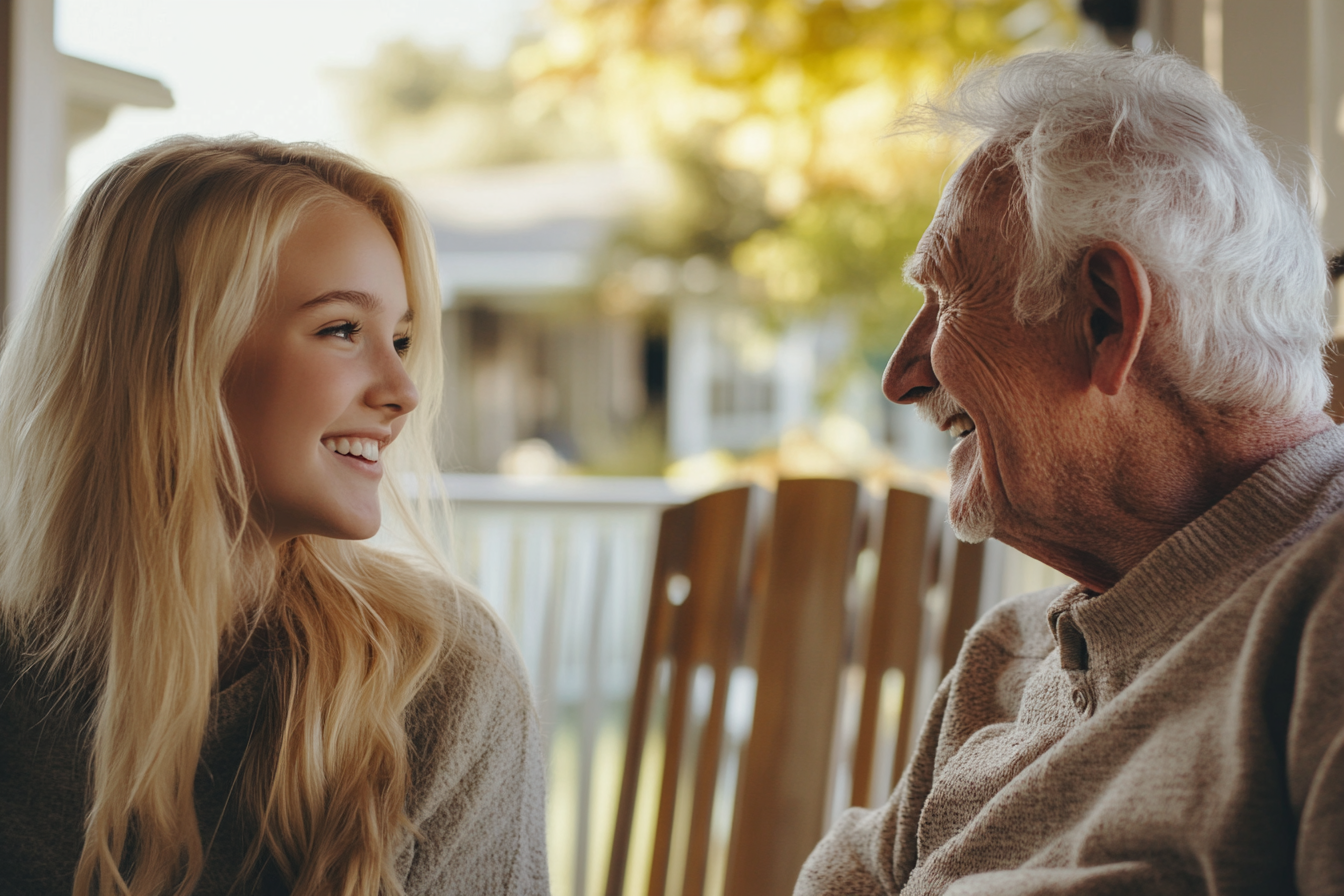 Une jeune femme assise sous un porche avec son grand-père | Source : Midjourney