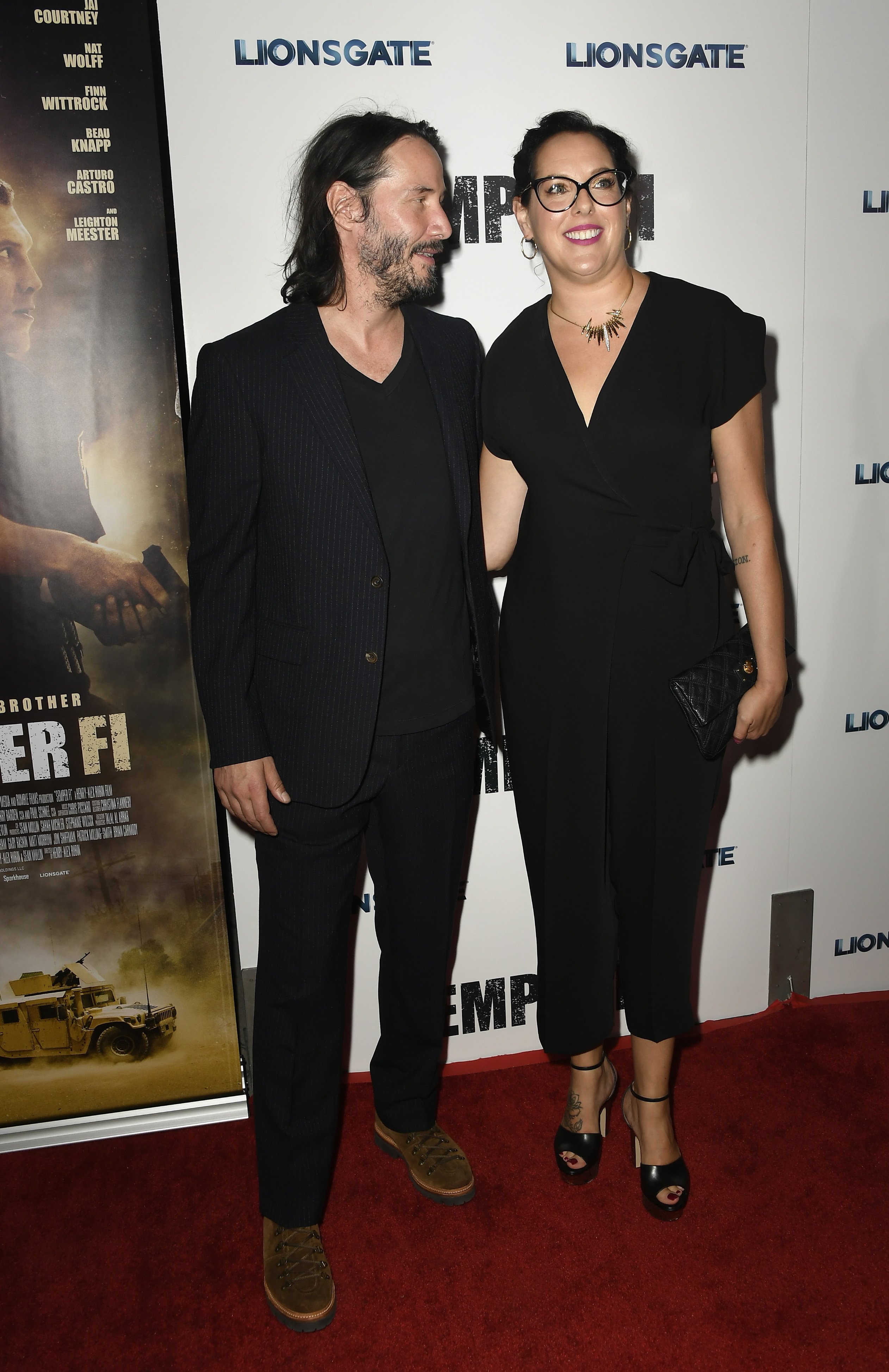 Keanu Reeves et sa sœur Karina Miller posent sur le tapis rouge lors d'une projection spéciale de "Semper Fi" de Lionsgate le 24 septembre 2019 à Hollywood | Source : Getty Images