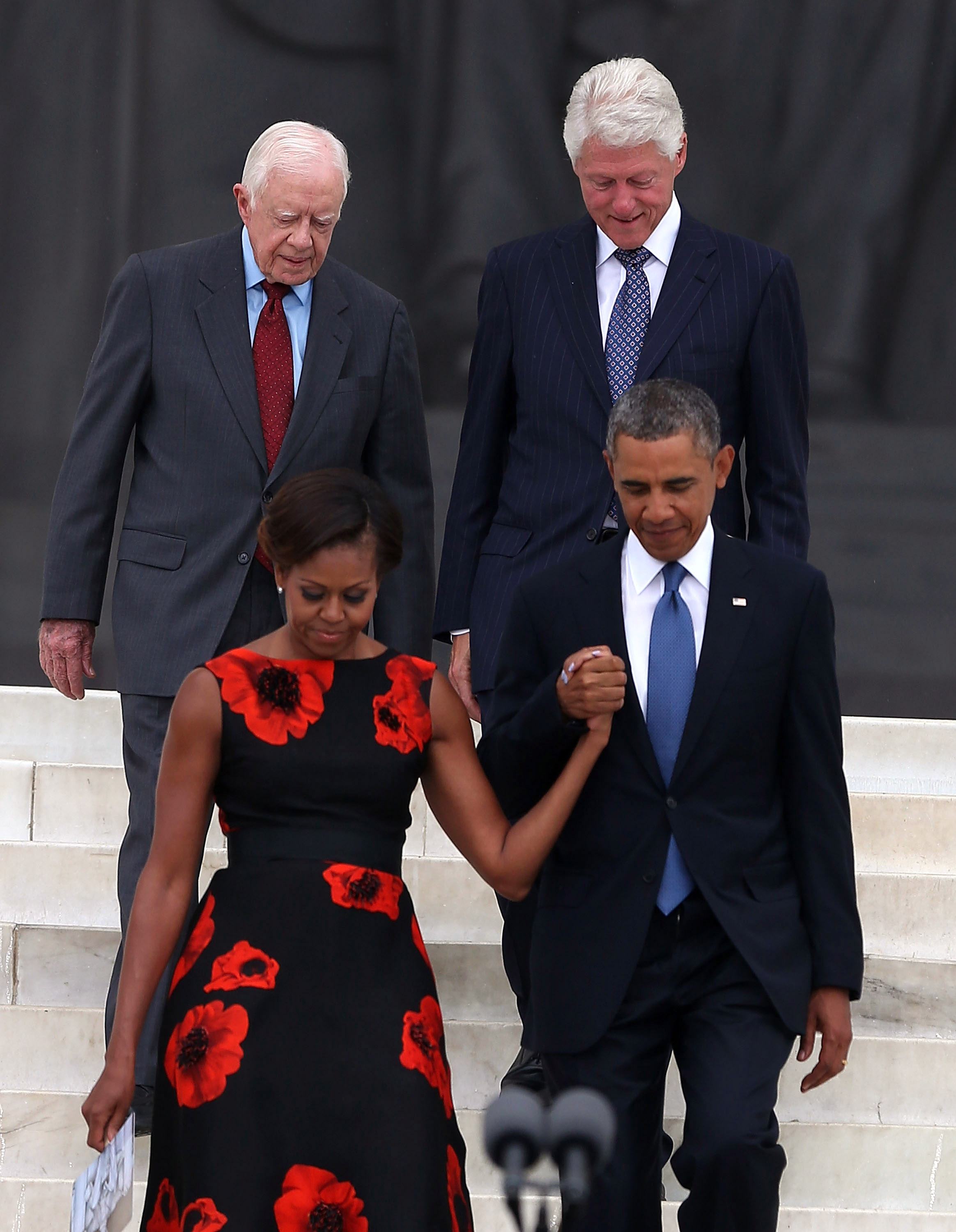 Jimmy Carter et Bill Clinton photographiés avec Michelle et Barack Obama le 28 août 2013, à Washington, D.C. | Source : Getty Images