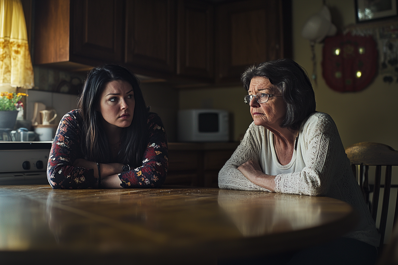 Deux femmes assises à une table de cuisine | Source : Midjourney