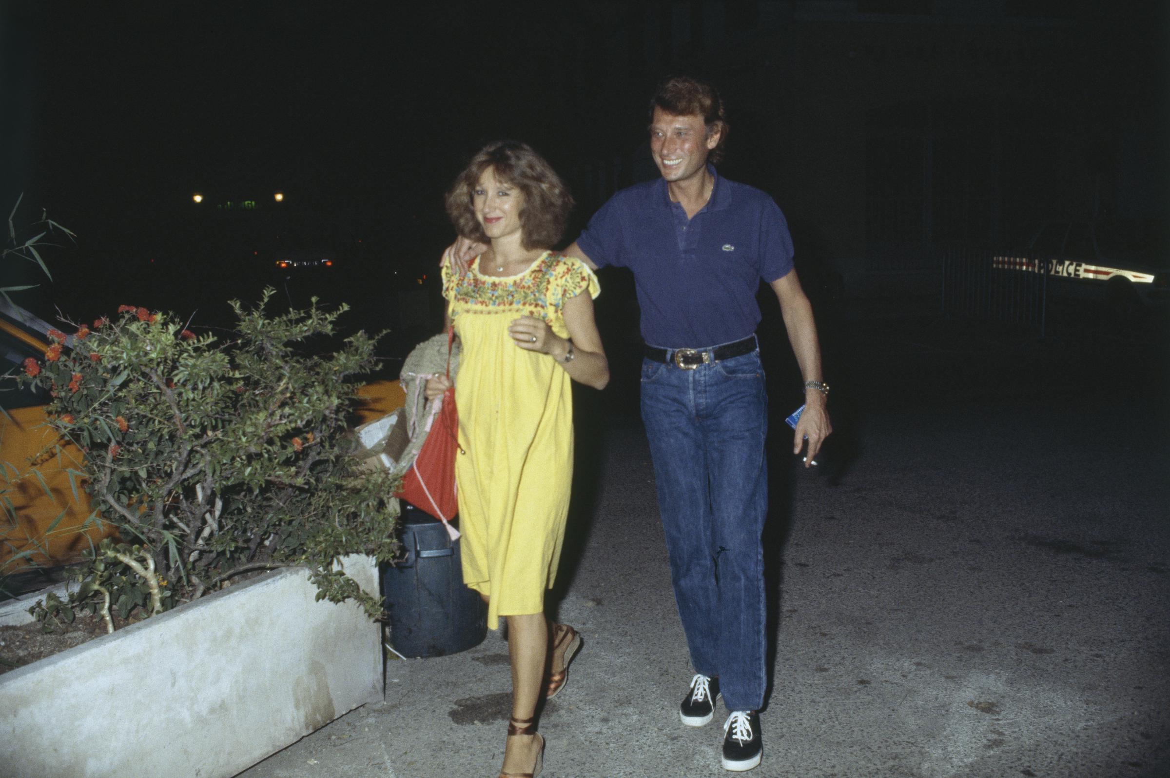 Johnny Hallyday et Nathalie Baye à Fréjus pour la dernière du spectacle du chanteur. Nathalie Baye donnera naissance quelques mois plus tard à leur fille Laura Smet I Source : Getty Images