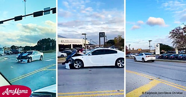 Un homme s'accroche au capot de la voiture pour ne pas être heurté par un conducteur ivre fou (vidéo)