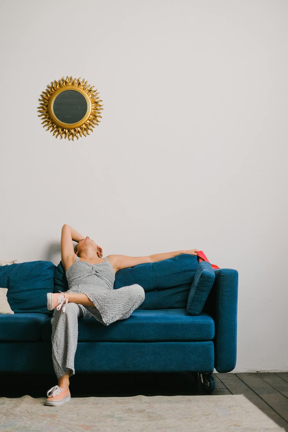 A tired woman on her sofa | Source: Pexels