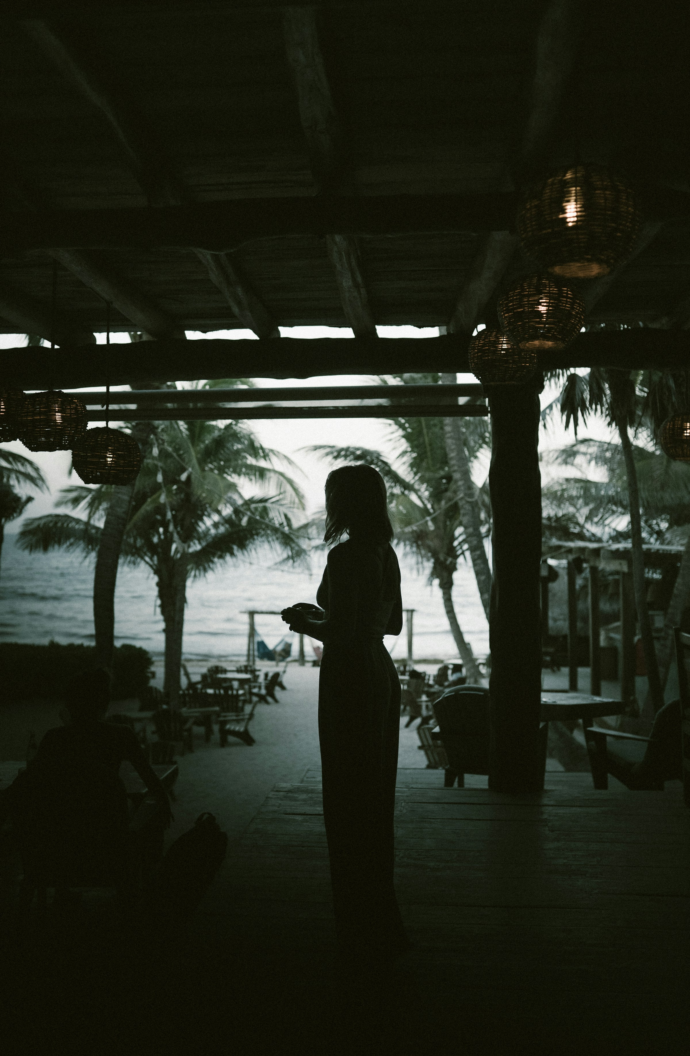 Silhouette of a woman near the beach | Source: Unsplash