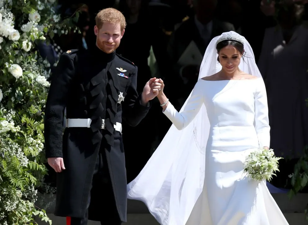 Le prince Harry et Meghan Markle partent après leur cérémonie de mariage à la chapelle Saint-Georges du château de Windsor, le 19 mai 2018. | Photo : Getty Images