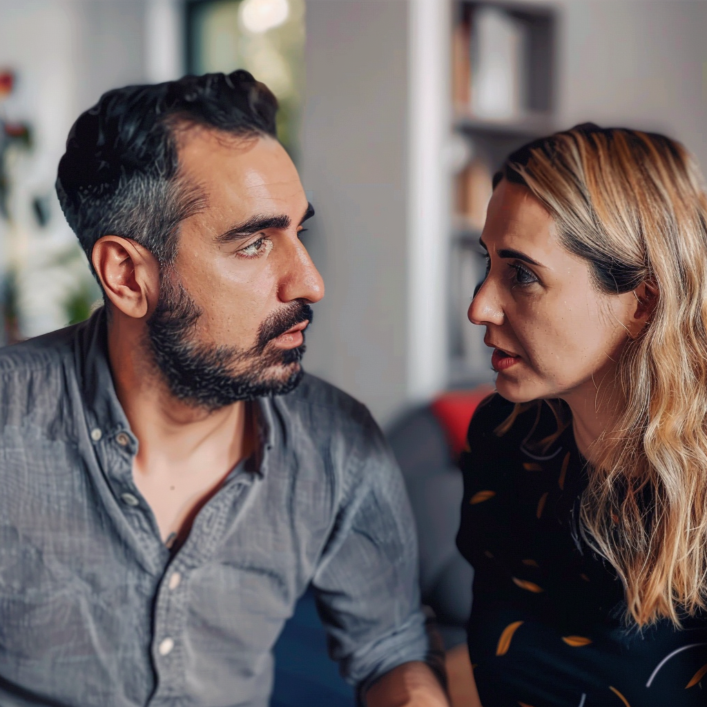 Un homme et une femme ayant une discussion sérieuse | Source : Midjourney