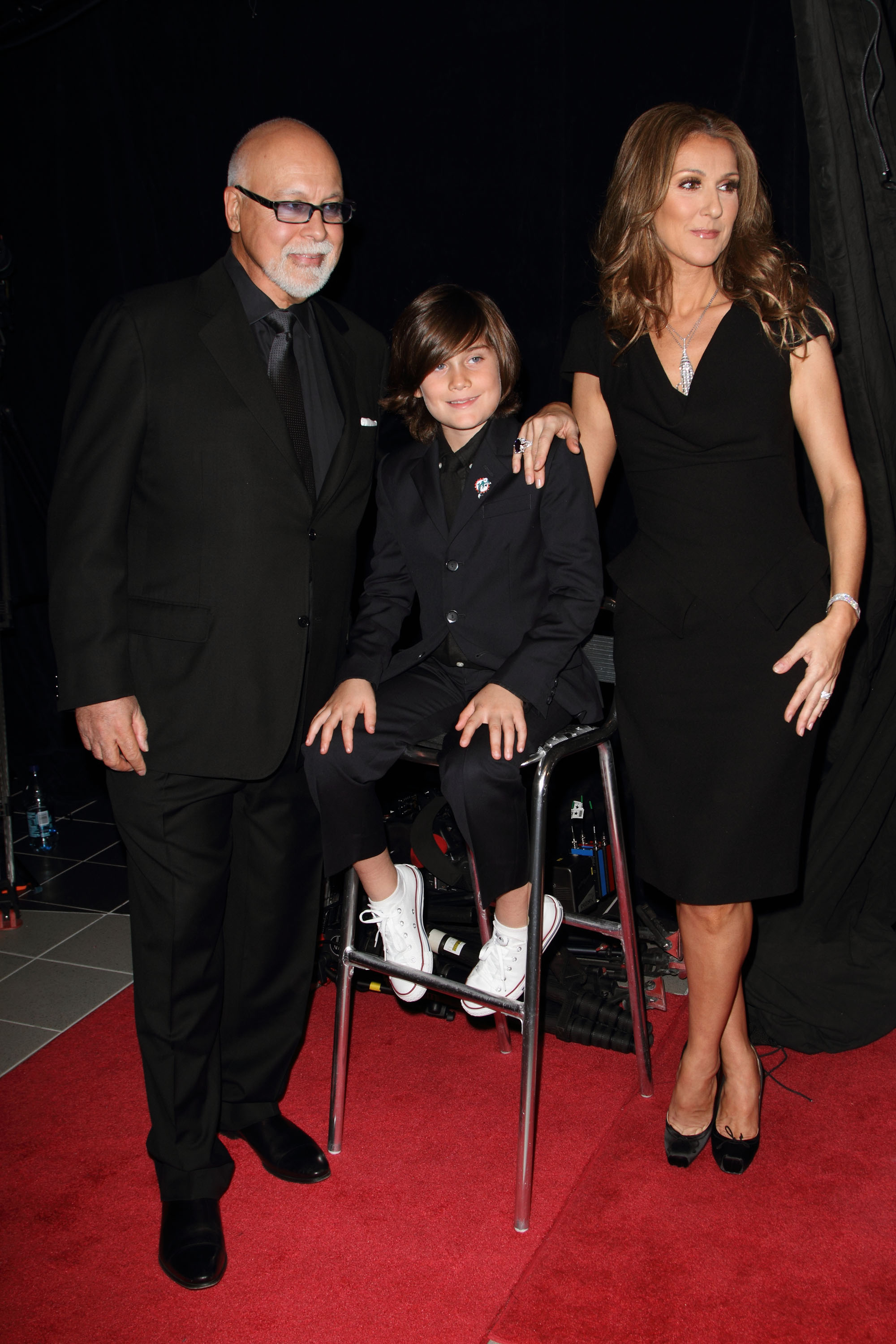 René Angelil, René-Charles Angelil et Céline Dion assistent à la première de "Céline : Through The Eyes of The World" à Miami Beach, Floride le 16 février 2010 | Source : Getty Images