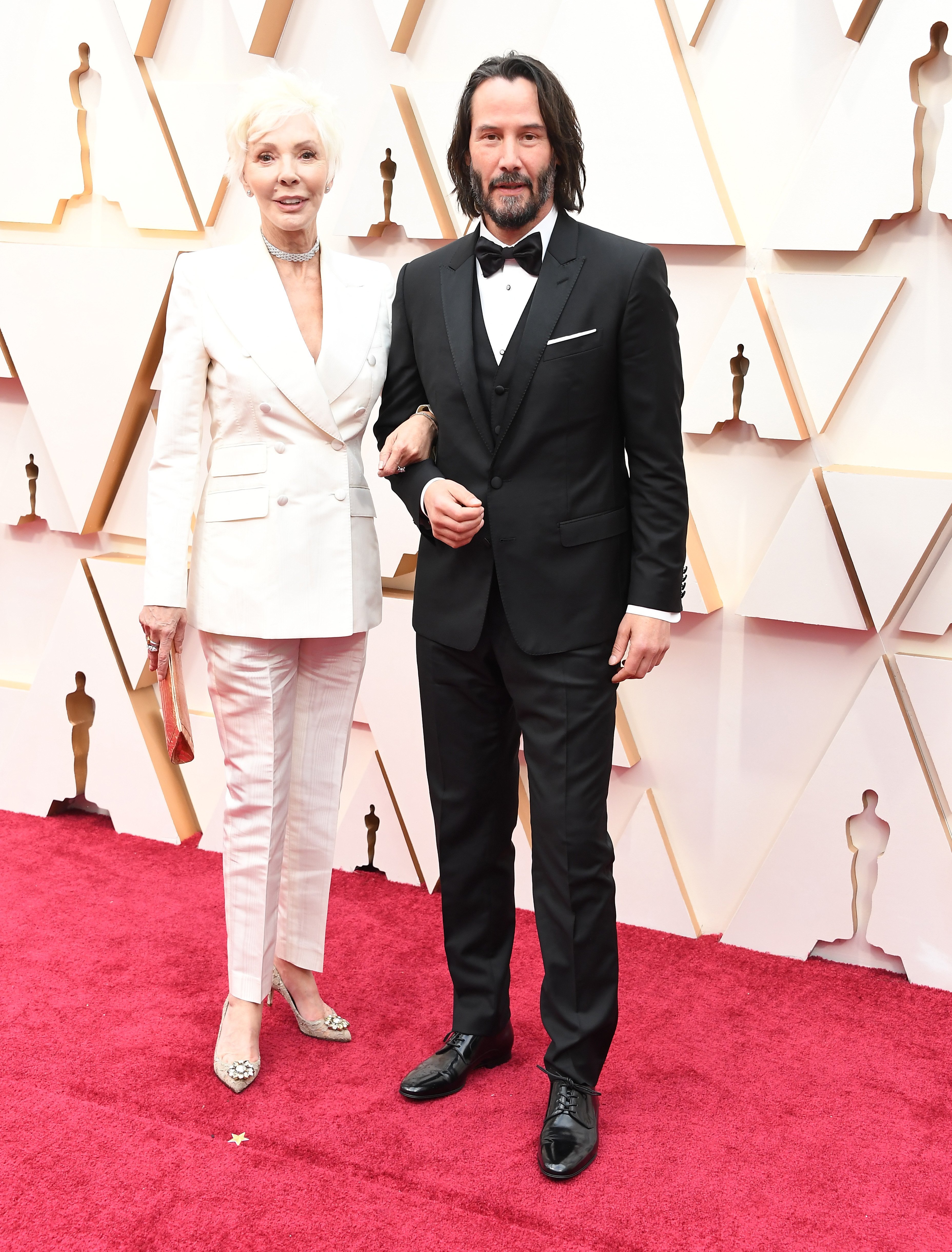 Patricia Taylor et Keanu Reeves arrivent à la 92ème cérémonie annuelle des Oscars à Hollywood et Highland le 09 février 2020 à Hollywood, Californie. | Photo : Getty Images