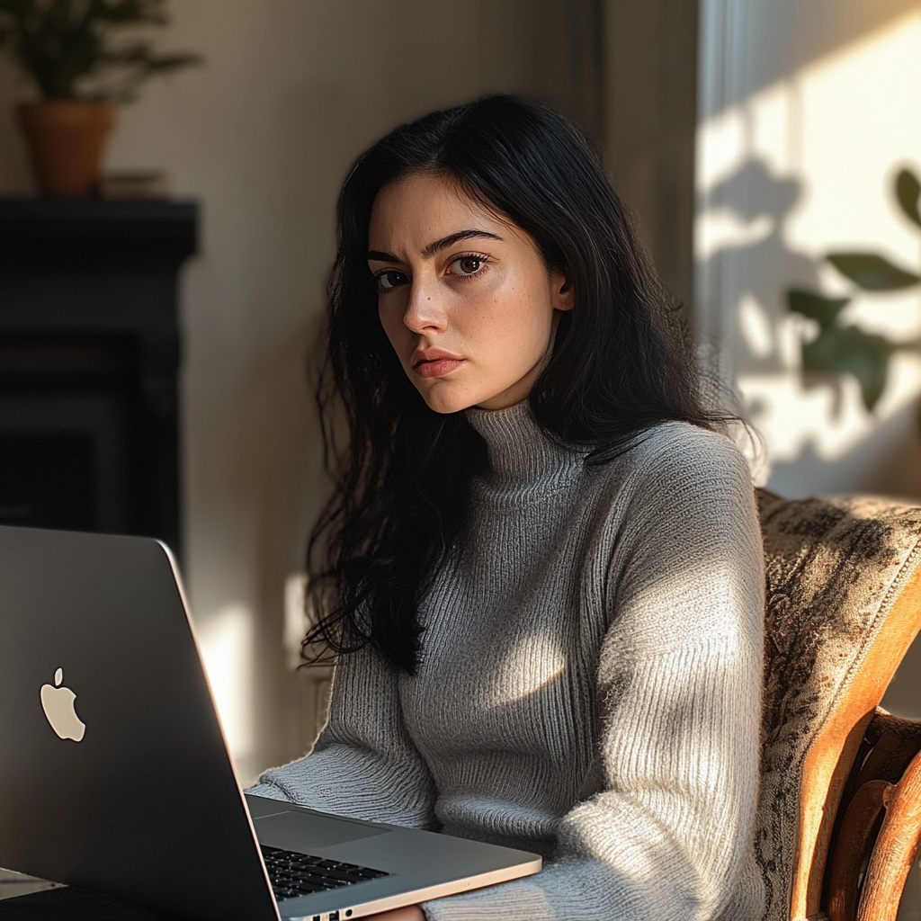 Femme épuisée se détournant de son ordinateur portable | Source : Midjourney