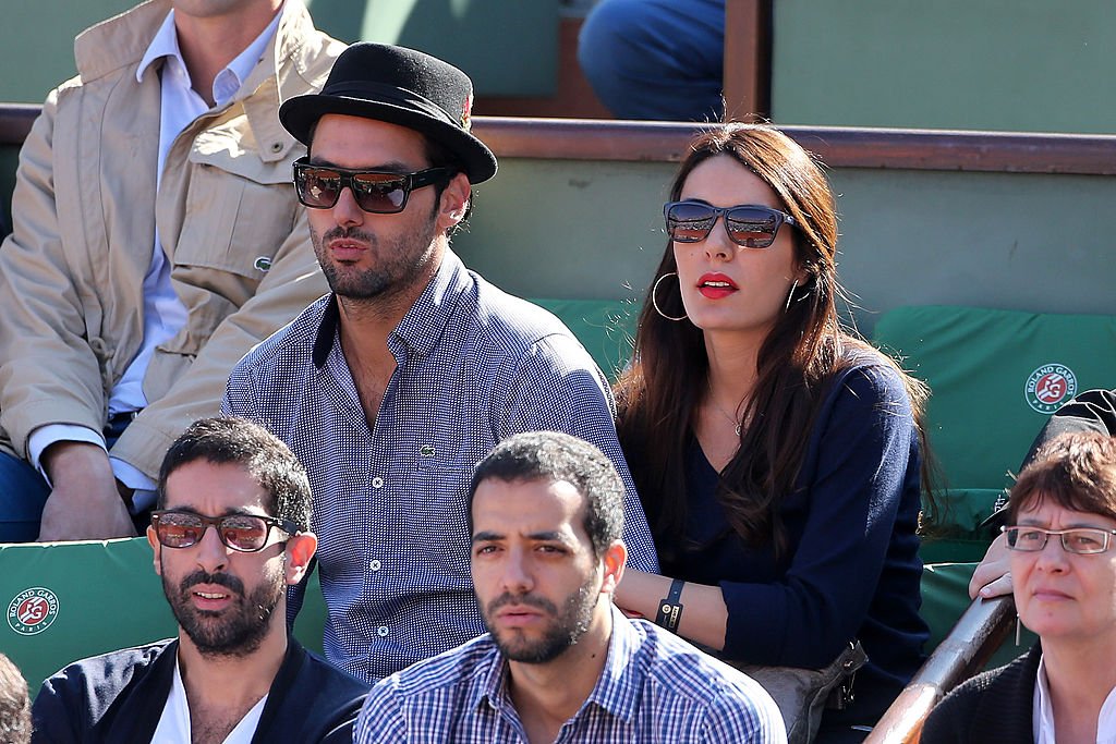 Sofia Essaidi et Adrien Galo assistent à la Coupe Davis - Demi-finale France vs République tchèque à Roland Garros le 12 septembre 2014 à Paris. | Photo : Getty Images