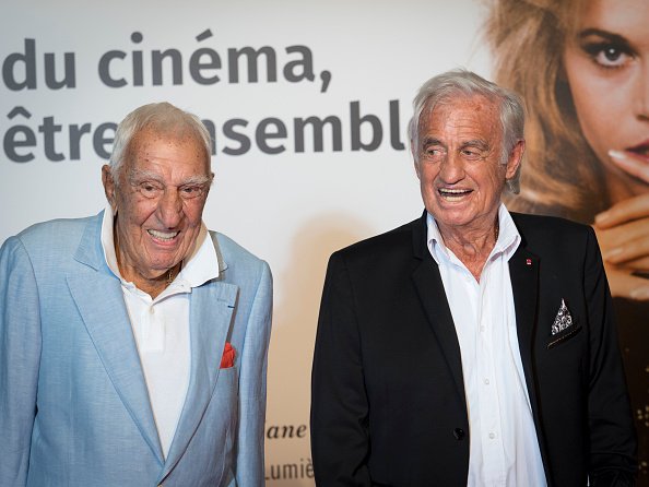 Charles Gérard et Jean-Paul Belmondo à la cérémonie d'ouverture du 10e Festival du film Lumière le 13 octobre 2018 à Lyon, France.  | Photo : Getty Images