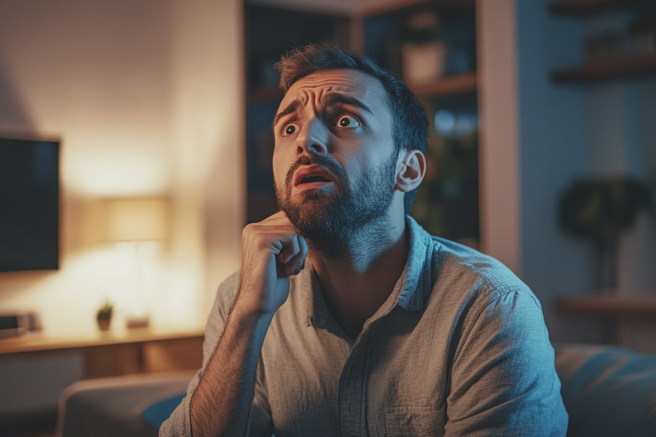 Un homme émotif à l'air confus et choqué | Source : Midjourney