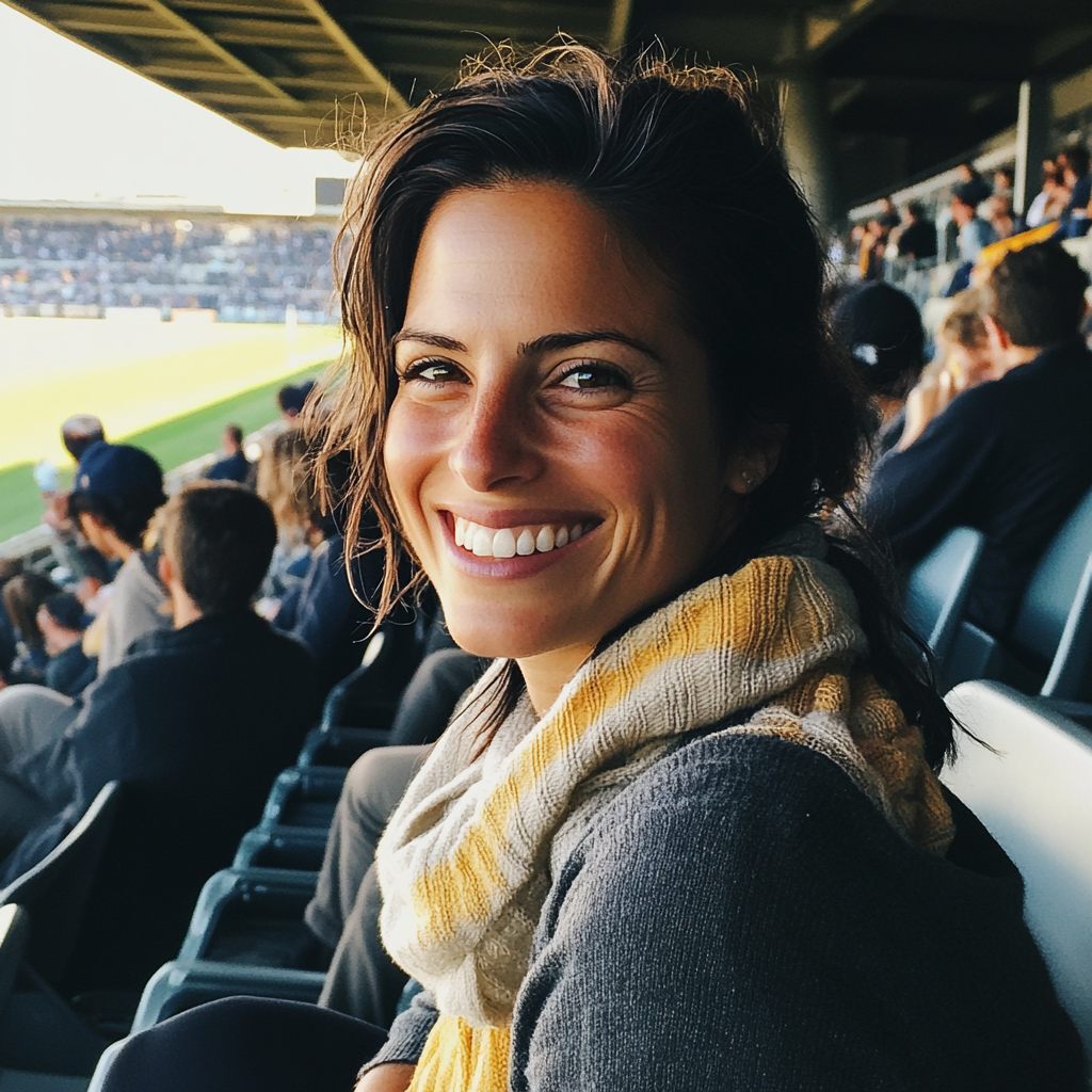 Une femme assise à un match de football | Source : Midjourney