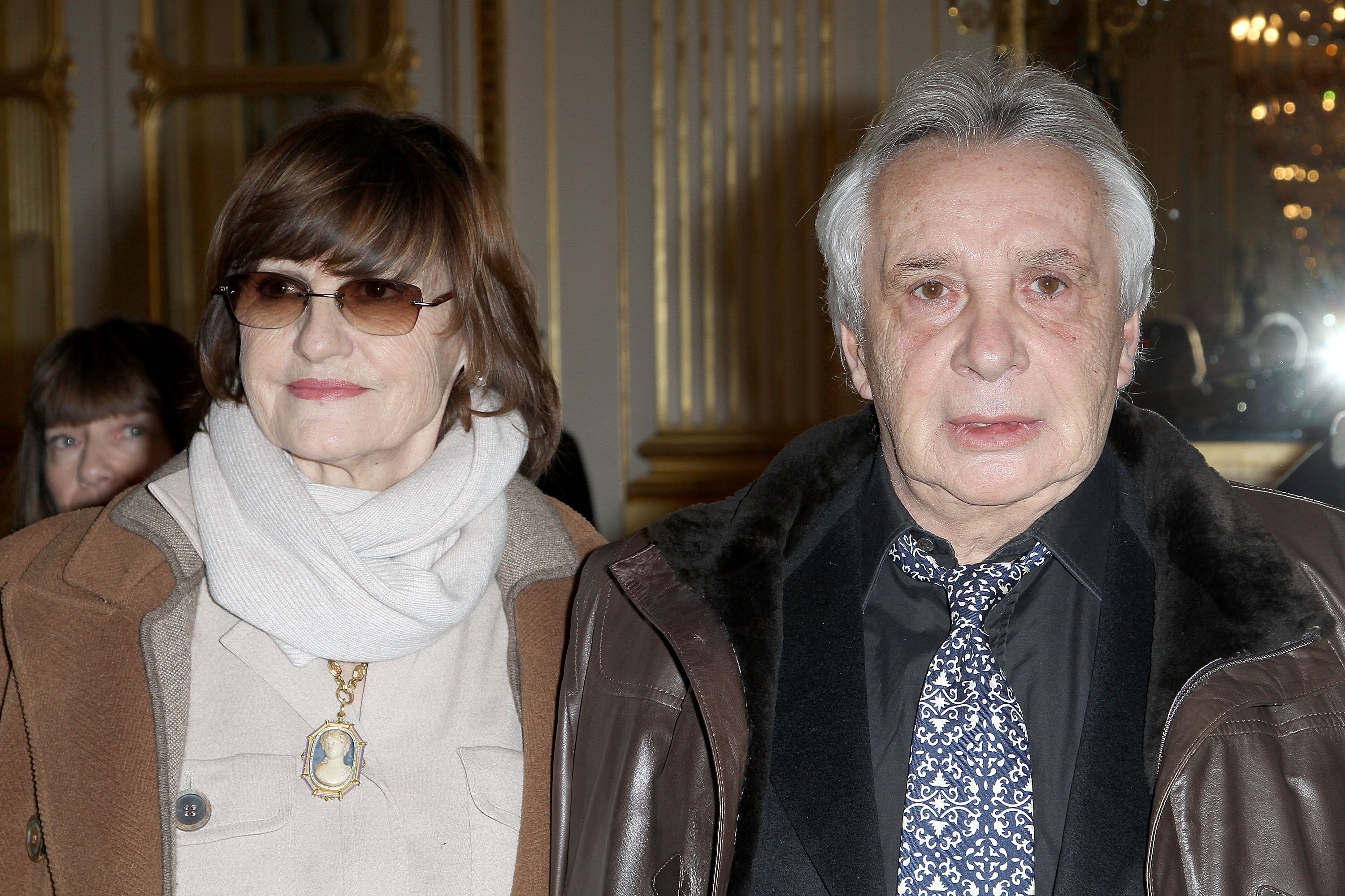 Michel Sardou et Anne-Marier Perier au Ministère de la Culture le 8 février 2012 à Paris, France. | Photo : Getty Images