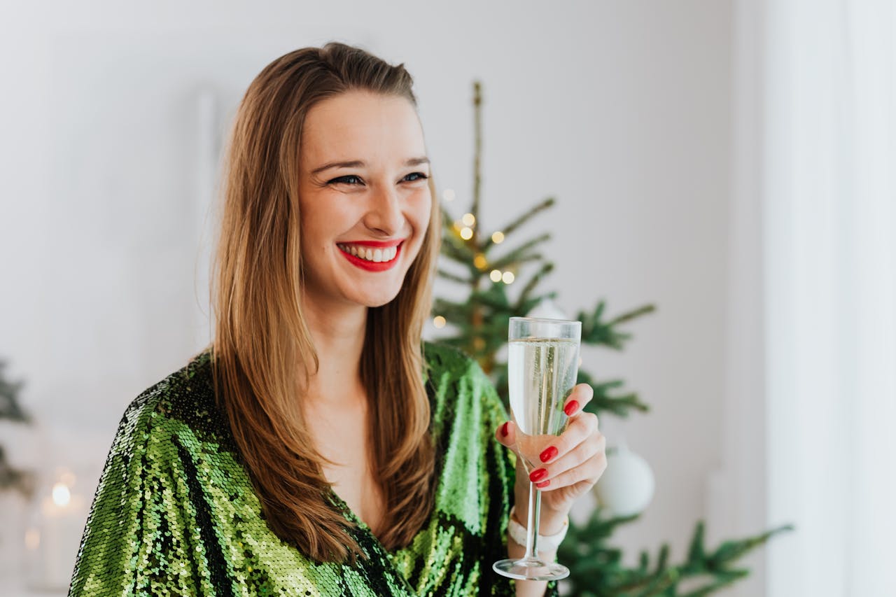 A delighted woman making a toast | Source: Pexels