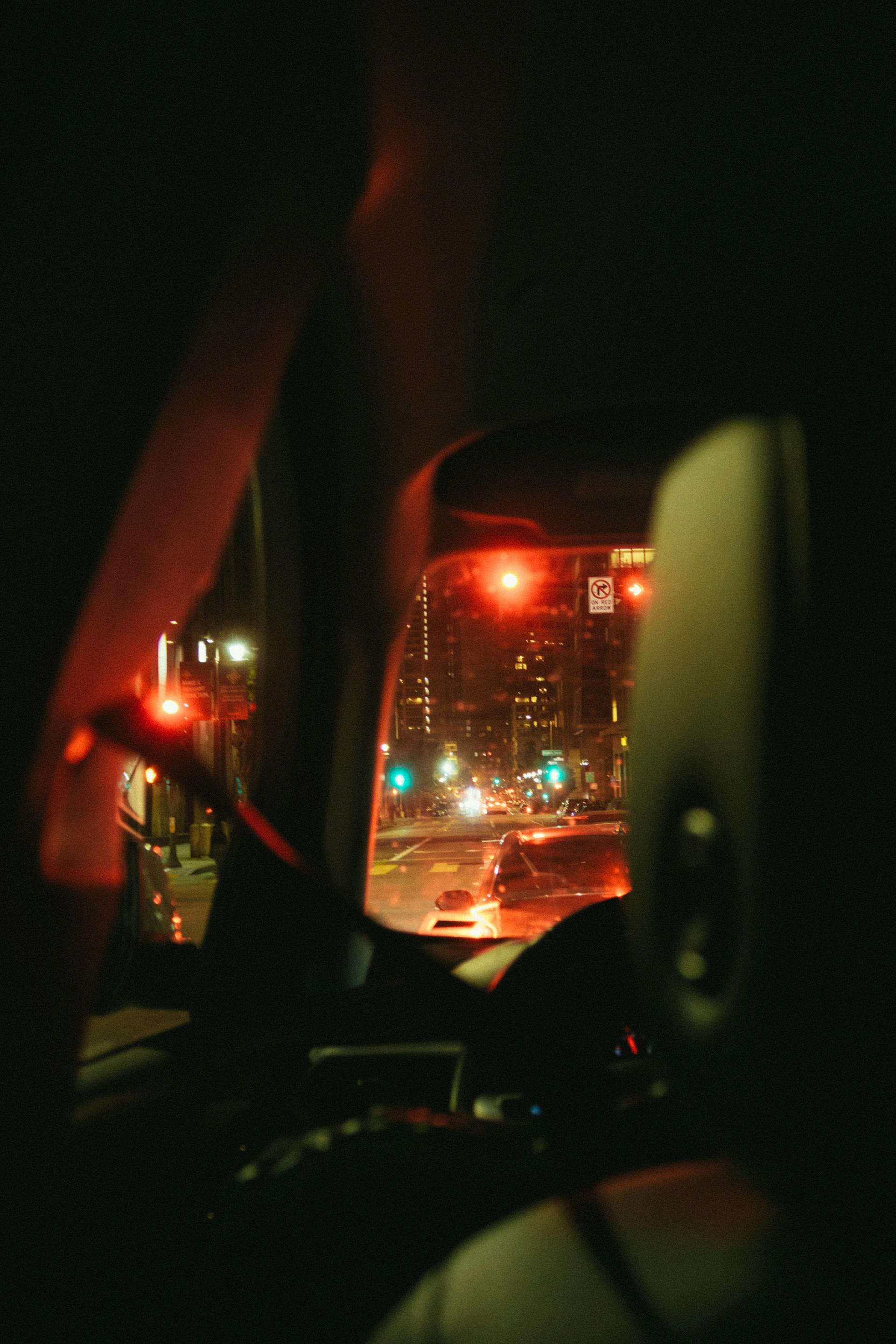 A car navigating traffic at night | Source: Pexels