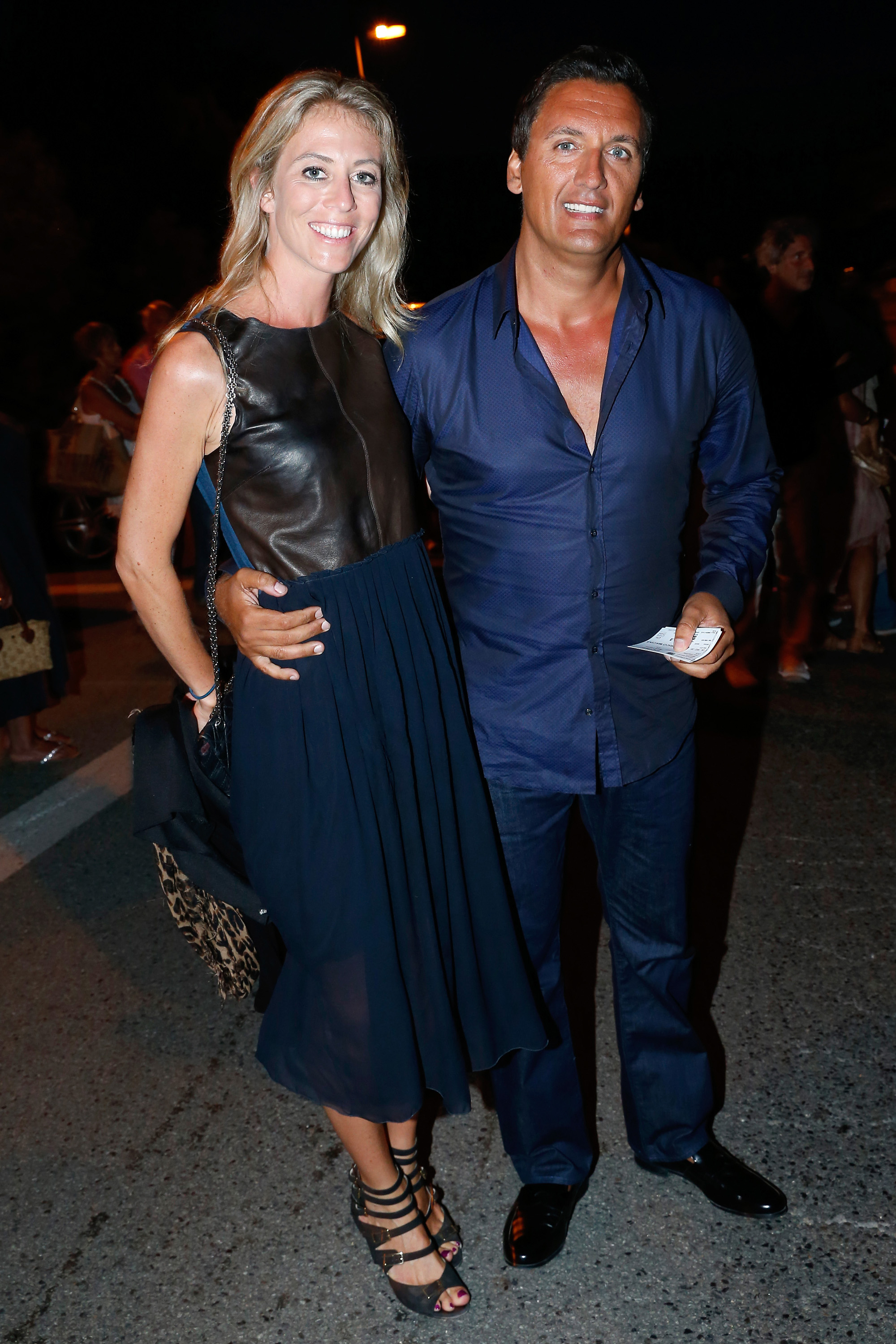 Dany Brillant et sa femme Nathalie Moury assistent au concert du chanteur Enrico Macias au 30e Festival de Ramatuelle : Jour 10 le 10 août 2014 à Ramatuelle, France I Source : Getty Images