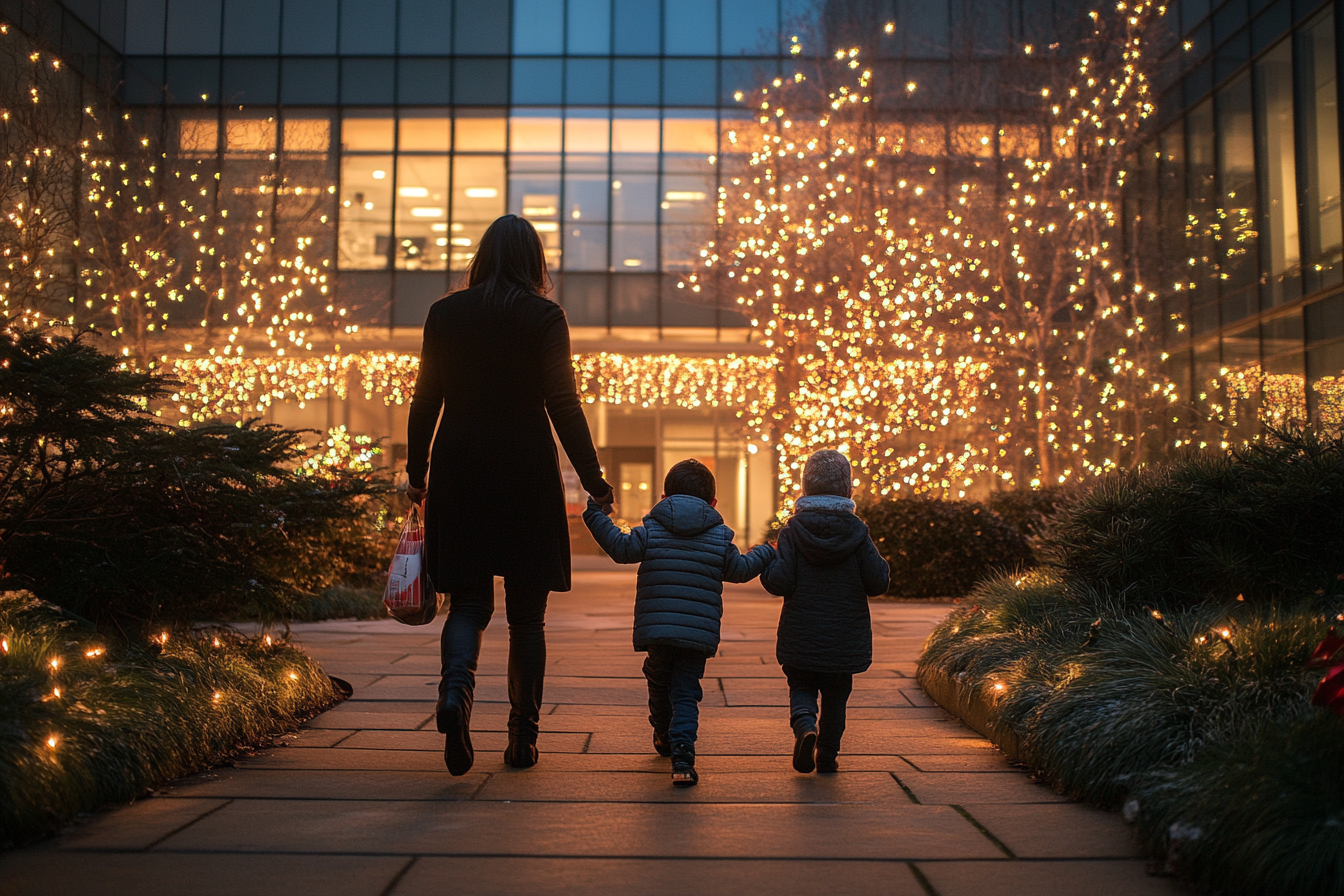 Une femme et ses enfants s'approchant d'un immeuble de bureaux | Source : Midjourney