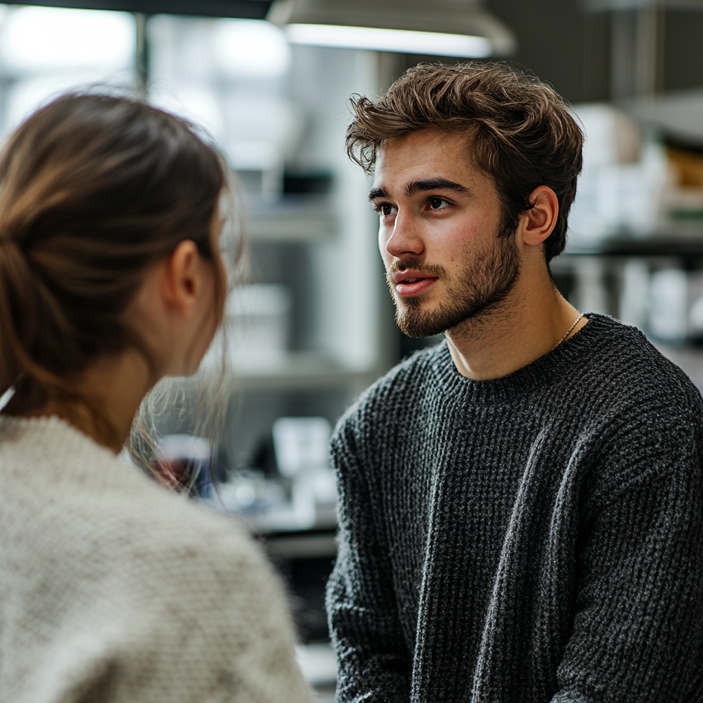 Un employé de laboratoire parle à une femme | Source : Midjourney