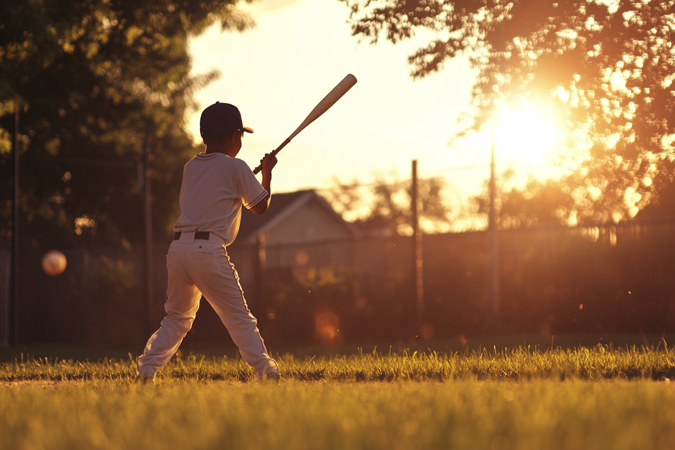 Un garçon tenant une batte de baseball | Source : Midjourney