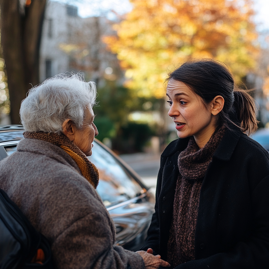 Une femme âgée parle à une femme d'âge moyen | Source : Midjourney