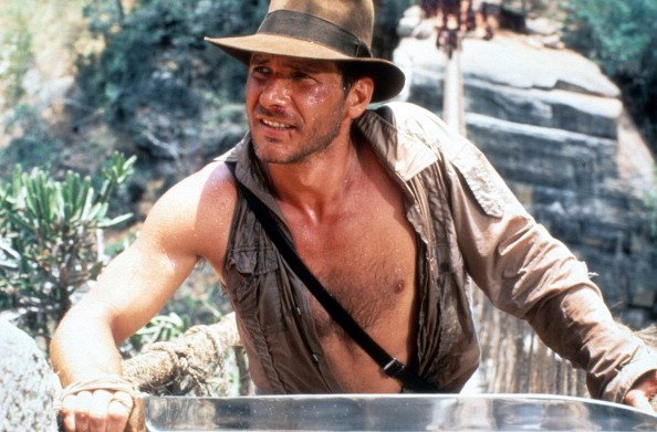 Harrison Ford dans une scène du film "Indiana Jones et le Temple Maudit", vers 1984. | Photo : Getty Images