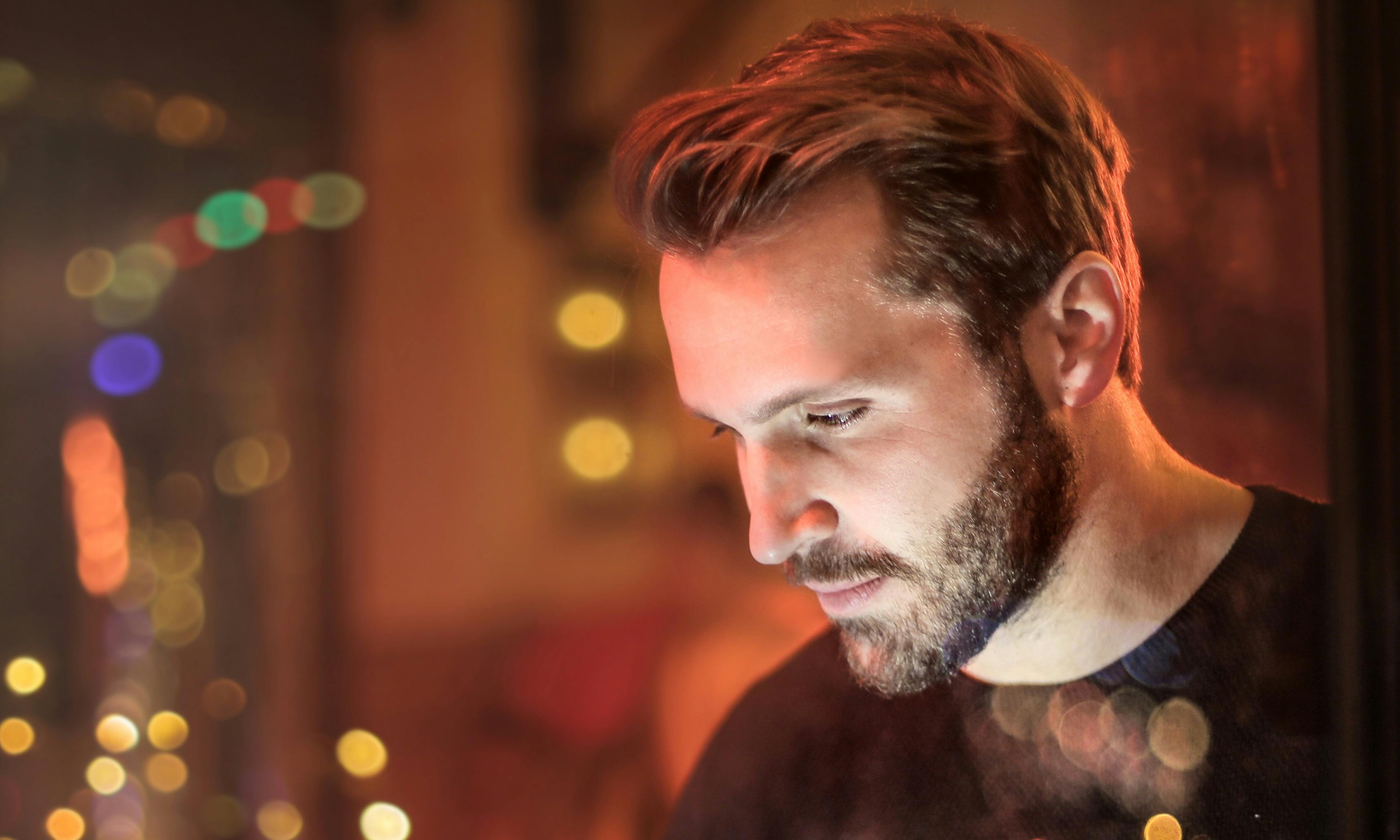 A man in a restaurant looking down | Source: Pexels