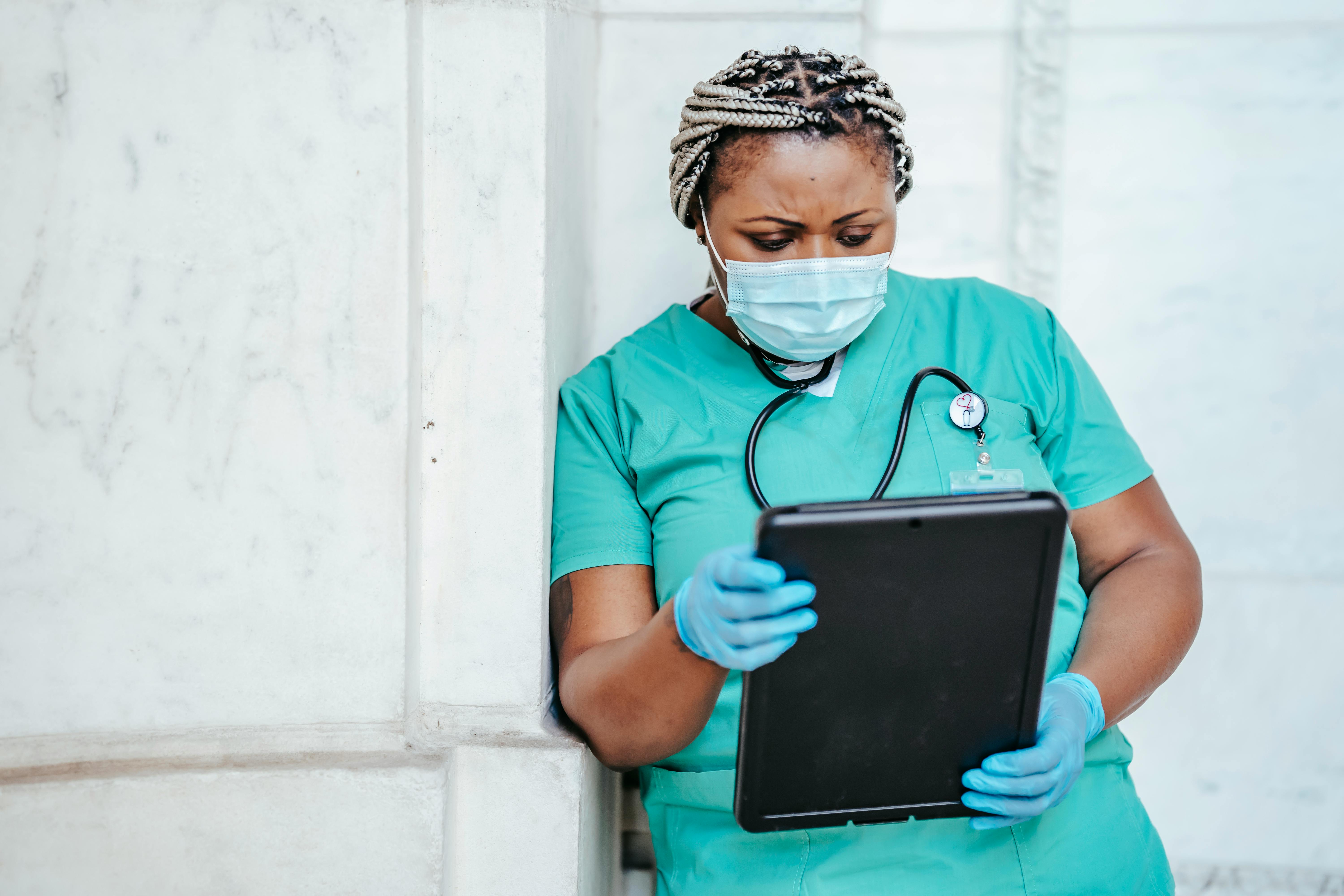 A doctor looks at his file | Source: Pexels