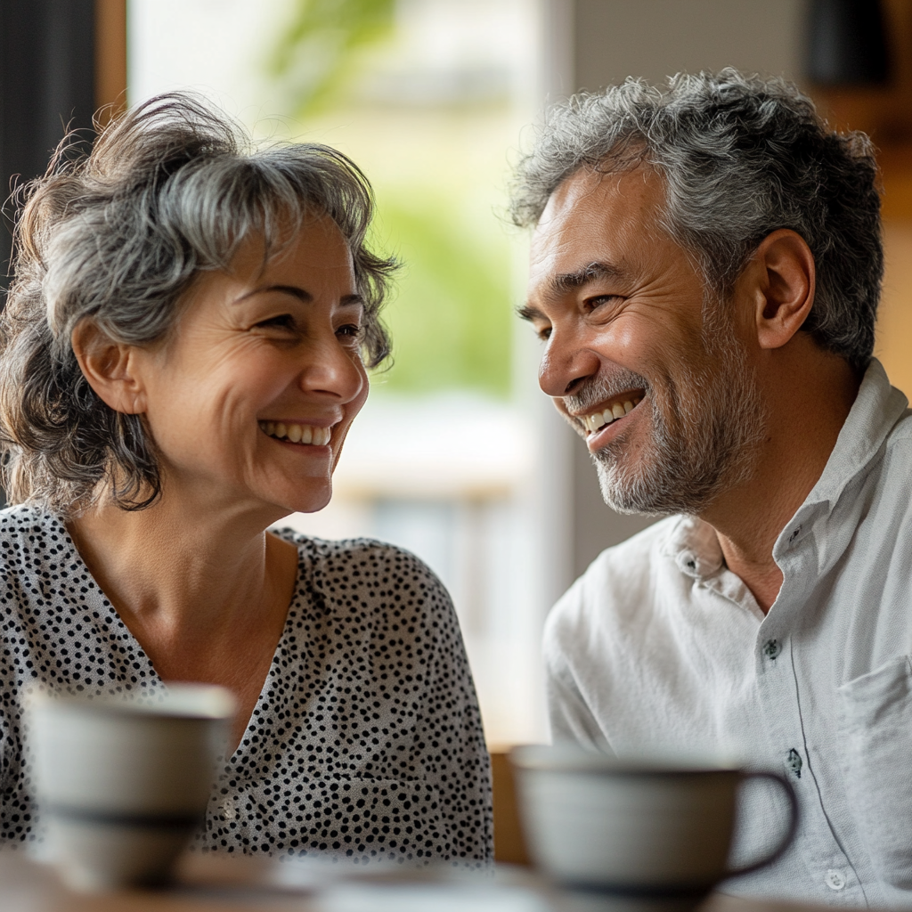 A smiling woman chats with a man | Source: Midjourney