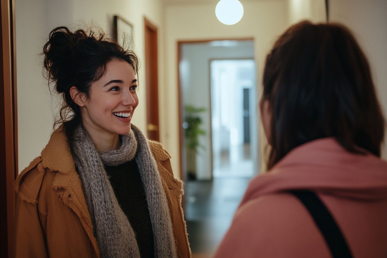 Neighbors greet each other in a building hallway | Source: Midjourney