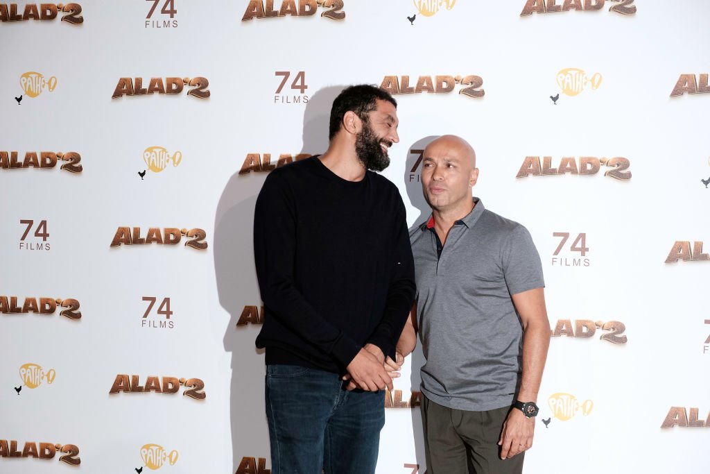 Ramzy Bedia et Eric Judor assistent à la première de "Alad'2" à Paris au Grand Rex le 21 septembre 2018 à Paris, France | Photo  : Getty Images