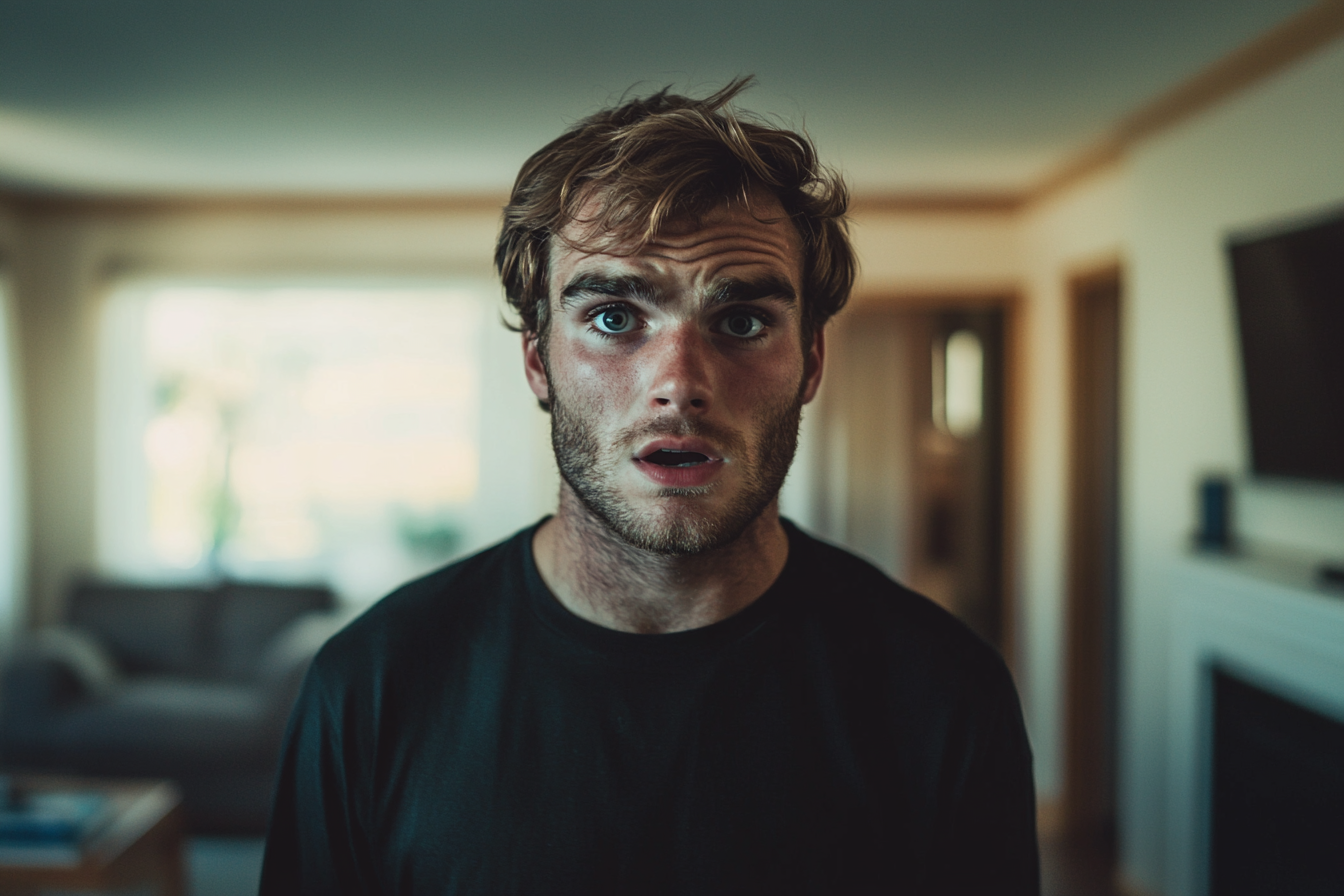 Un homme choqué dans un salon | Source : Midjourney