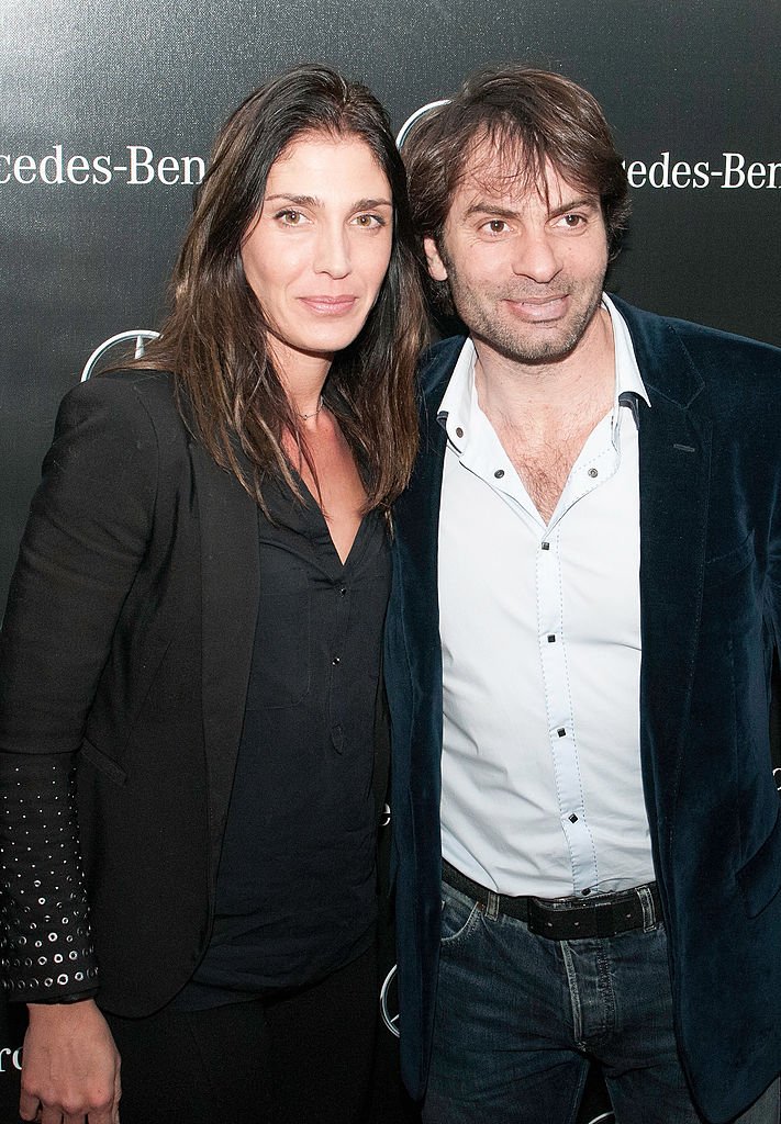 Loretta Dominici et le rugbyman Christophe Dominici assistent à l'ouverture du Pop-Up Store Mercedes Benz sur les Champs-Élysées, le 11 mars 2014 à Paris, en France. | Photo : Getty Images