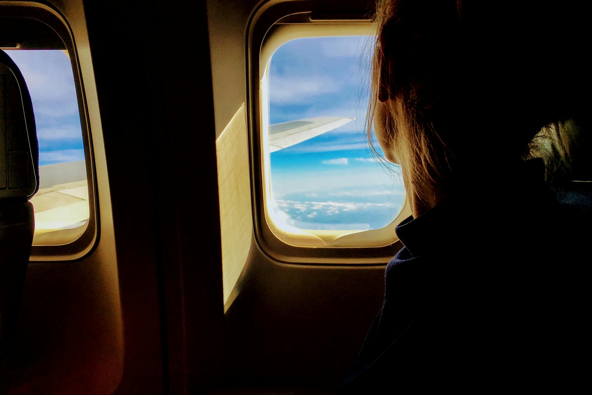 Une femme à bord d'un avion | Source : Pexels