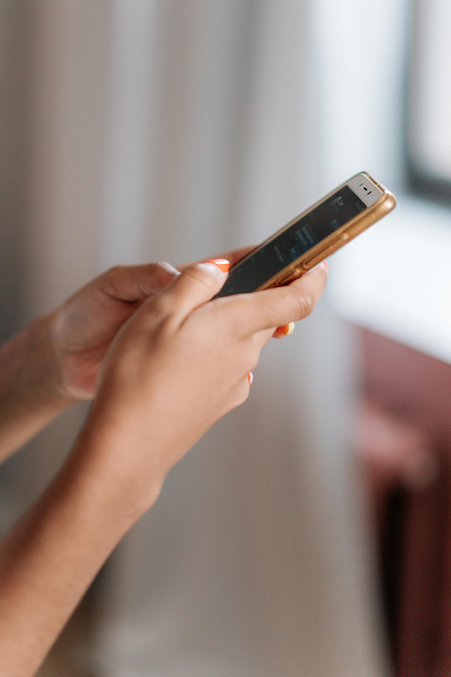 A woman using a phone | Source: Pexels