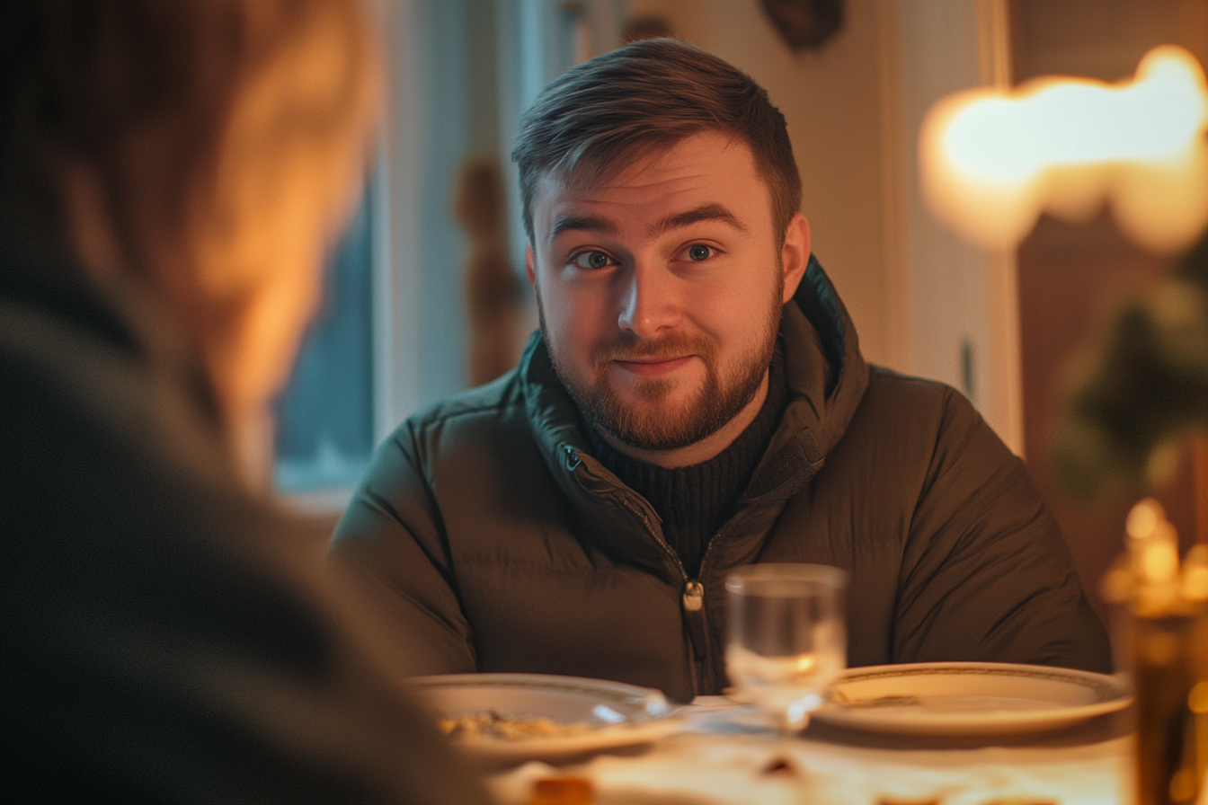 Homme assis à la table du dîner | Source : Midjourney