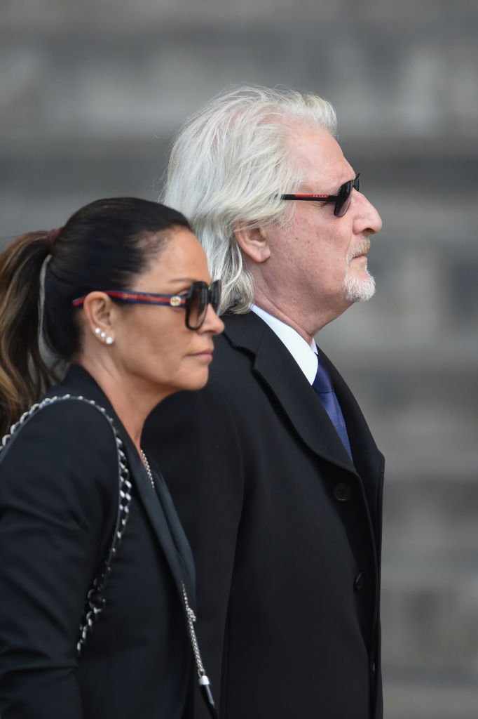 Patrick Sébastien (R) et son épouse Nathalie Boutot arrivent pour assister à un service religieux pour l'ancien président français Jacques Chirac à l'église Saint-Sulpice le 30 septembre 2019 à Paris, France. | Photo : Getty Images