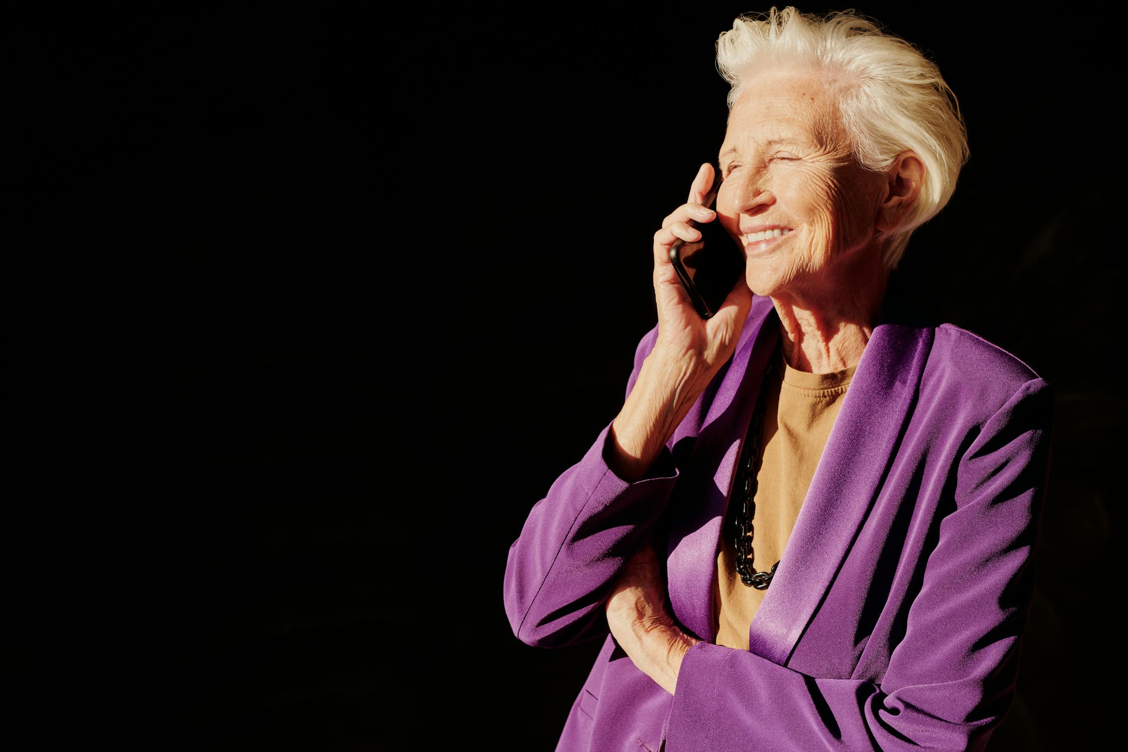 A smiling woman talking on the phone | Source: Pexels