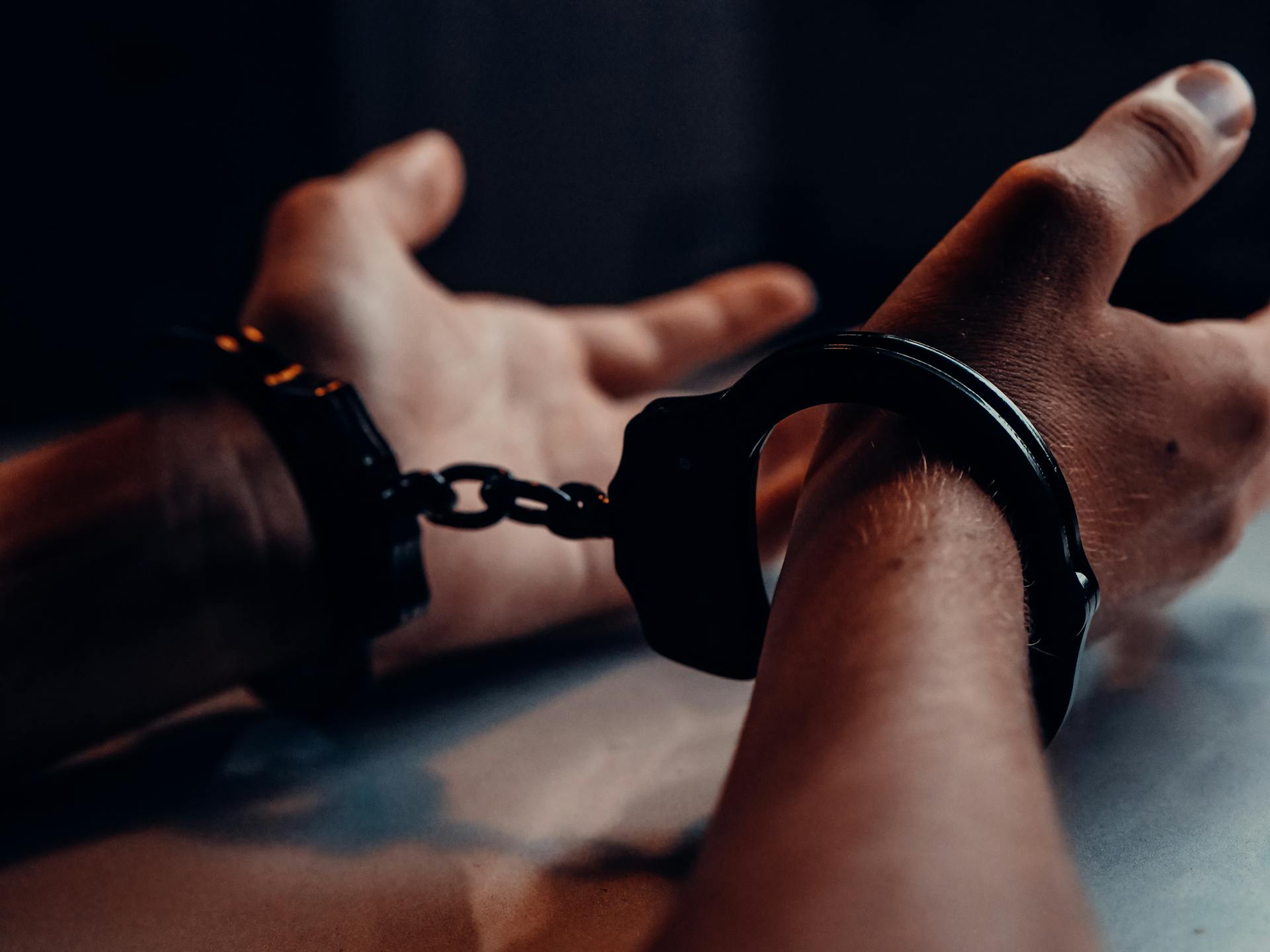 A man in handcuffs | Source: Pexels