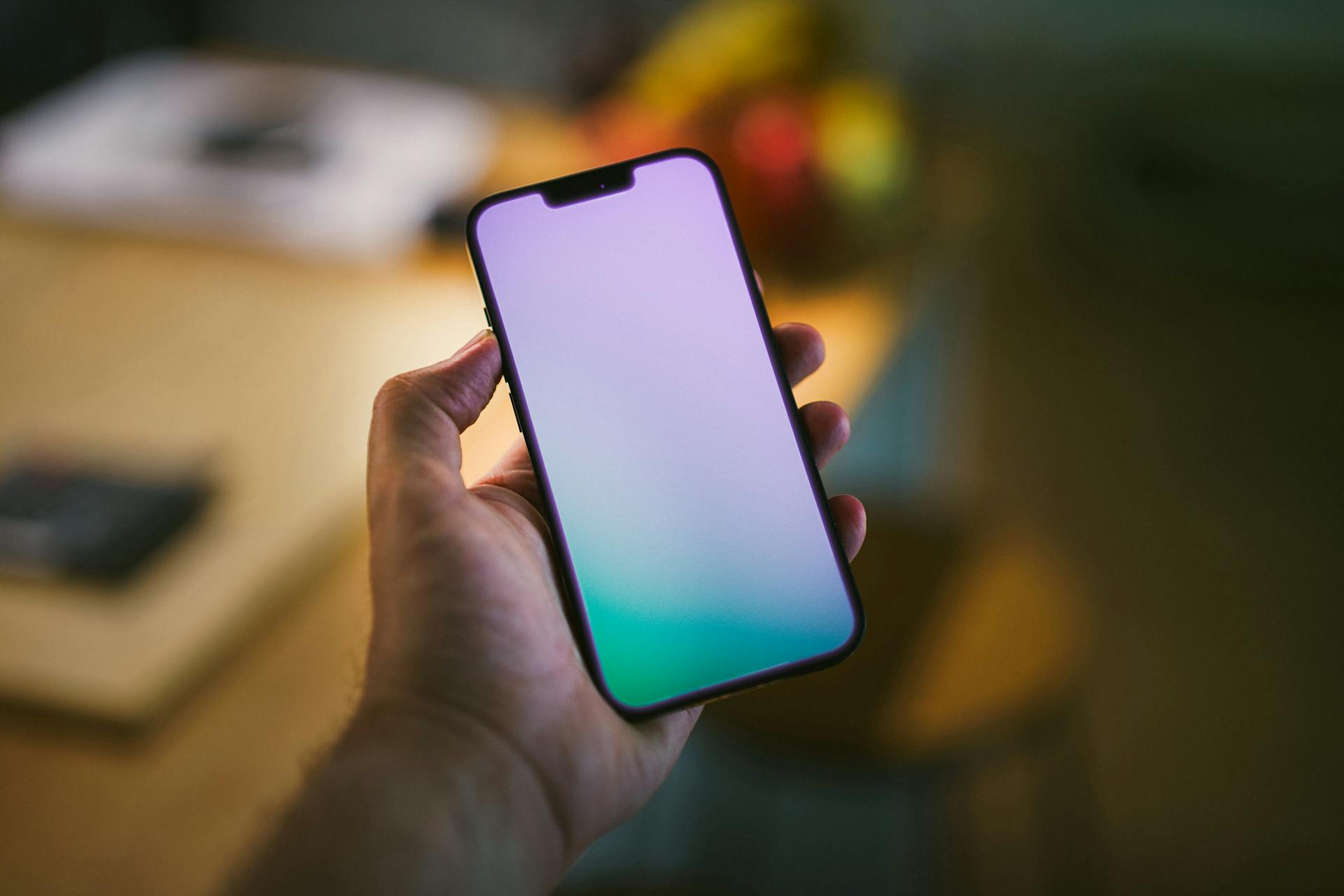 Cropped photo of a man holding his phone | Source: Pexels