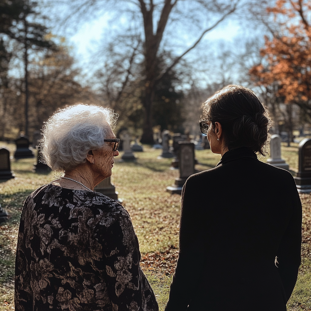 Une femme âgée et une jeune femme sur une tombe | Source : Midjourney