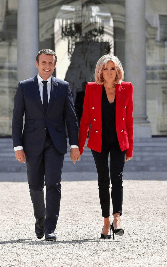 Brigitte et Emmanuel Macron main dans la main. l Photo : Getty Images