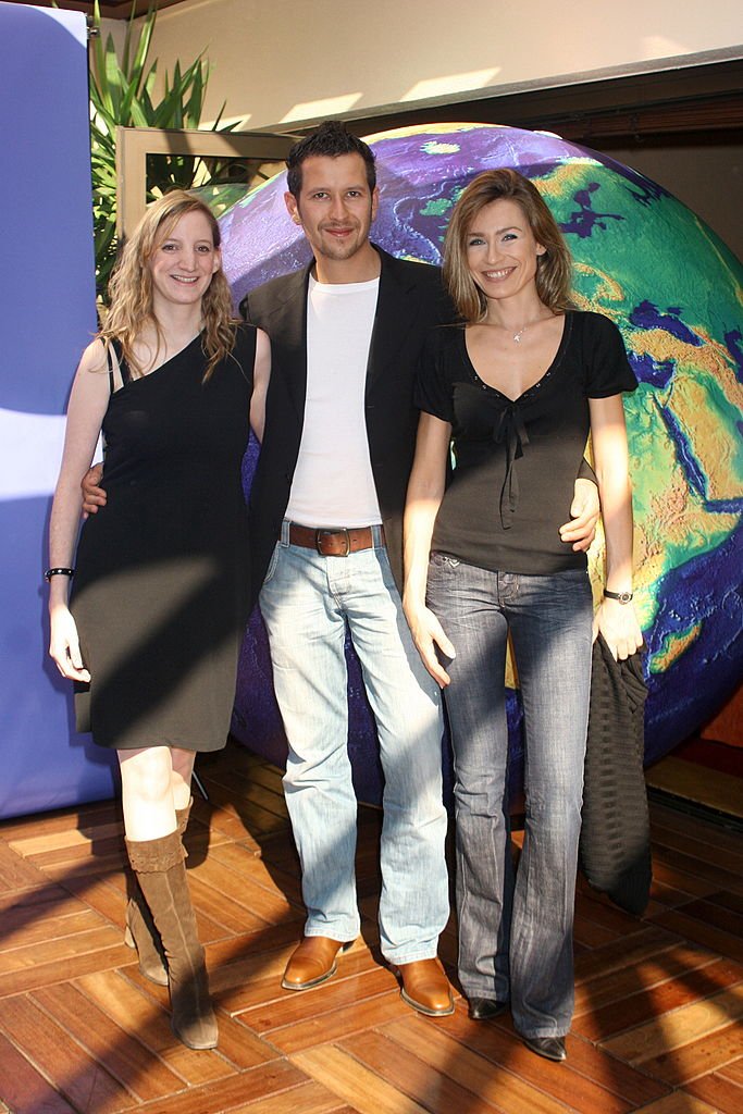 Geraldine de Mori, David Kolski, BFM RMC et Sandra Larue, BFM TV à Paris, France le 29 septembre 2006. | Photo : Getty Images