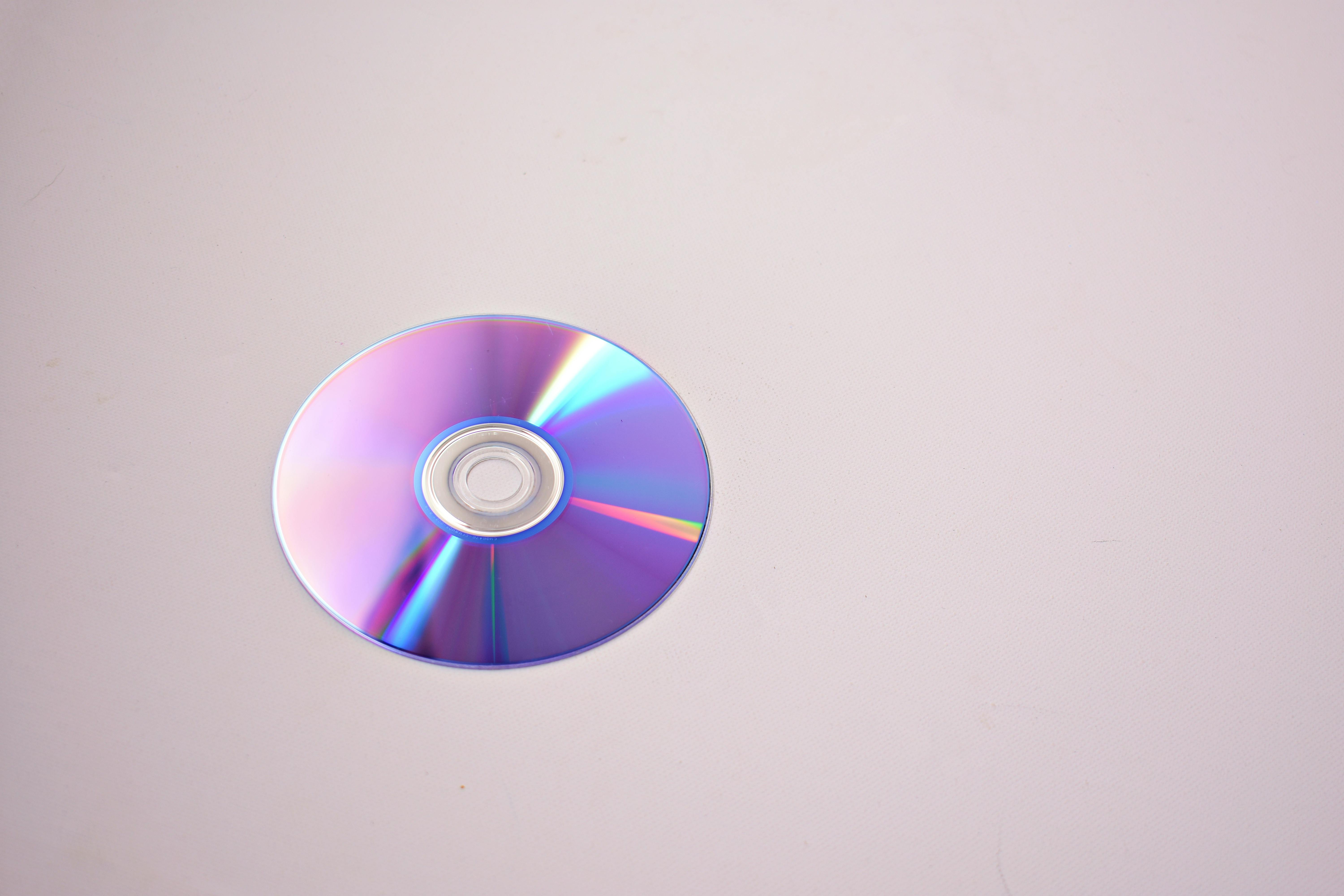 A CD on a gray surface | Source: Pexels