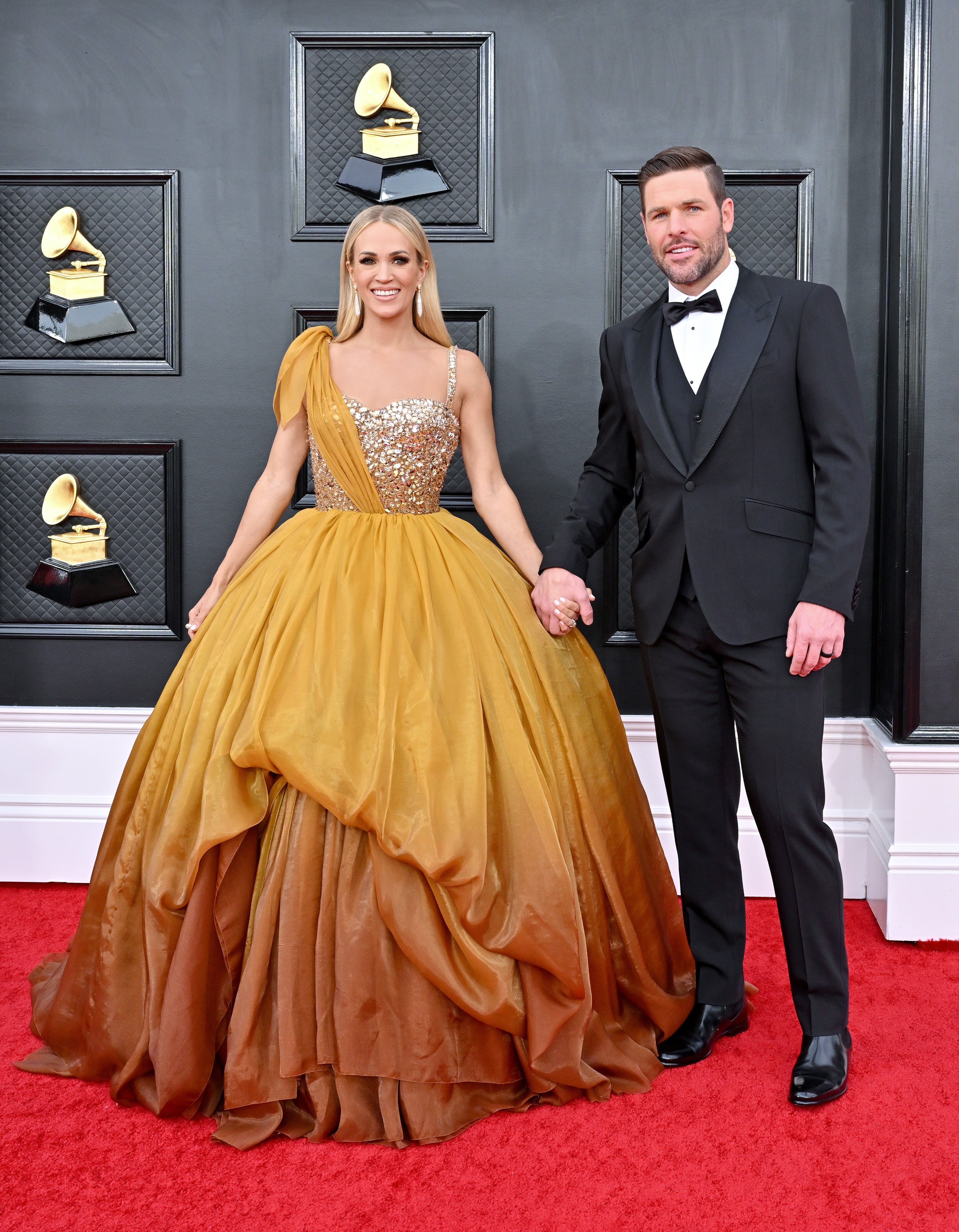 Carrie Underwood et Mike Fisher assistent à la 64e cérémonie annuelle des GRAMMY Awards au MGM Grand Garden Arena le 3 avril 2022 à Las Vegas, Nevada. | Source : Getty Images