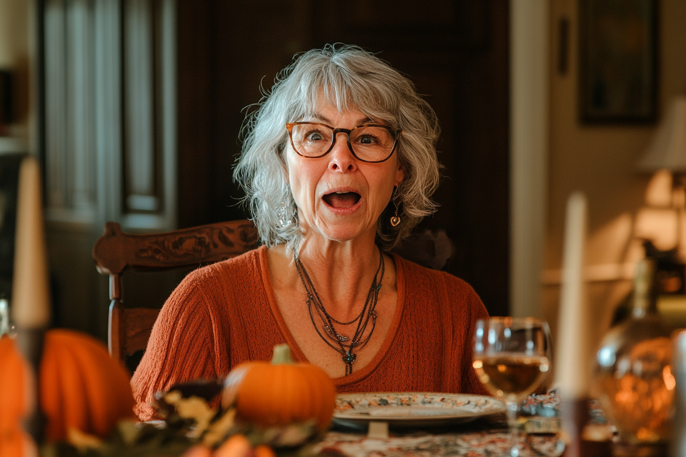 Une femme choquée assise à une table à manger | Source : Midjourney