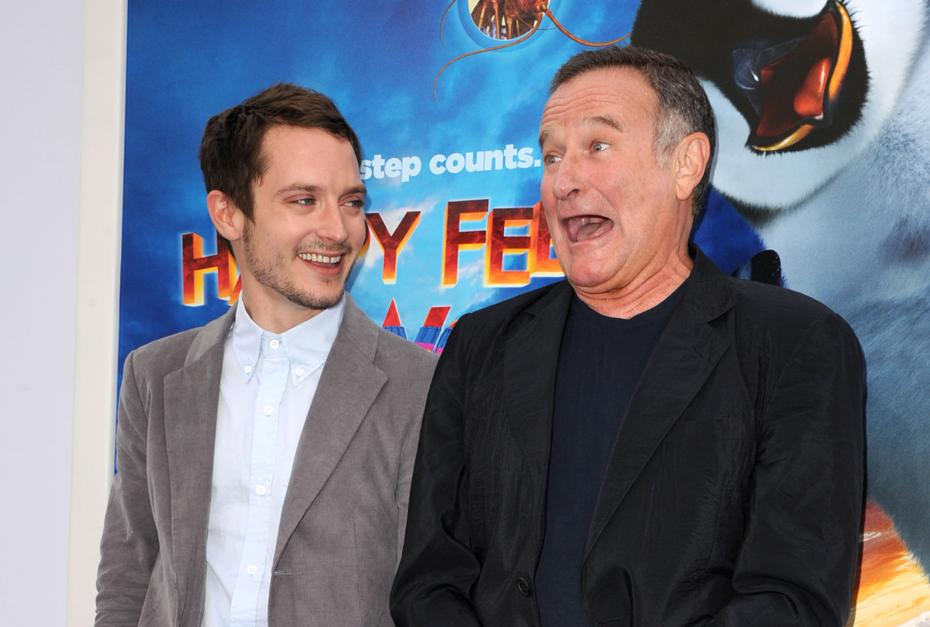 Elijah Wood et Robin Williams lors de la première de "Happy Feet Two" le 13 novembre 2011, à Hollywood, en Californie. | Source : Getty Images