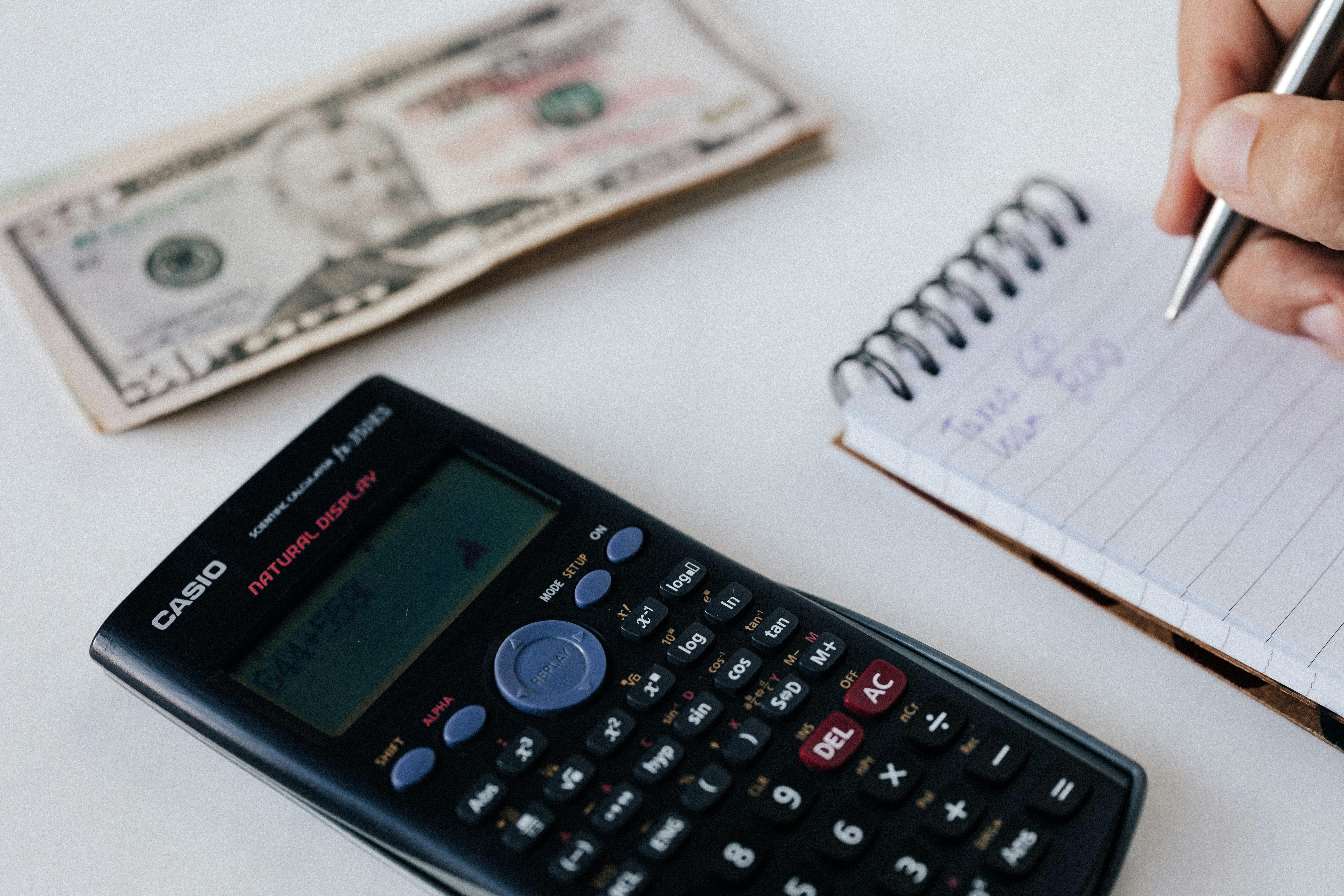 Someone is doing math while trying to save money | Source: Pexels