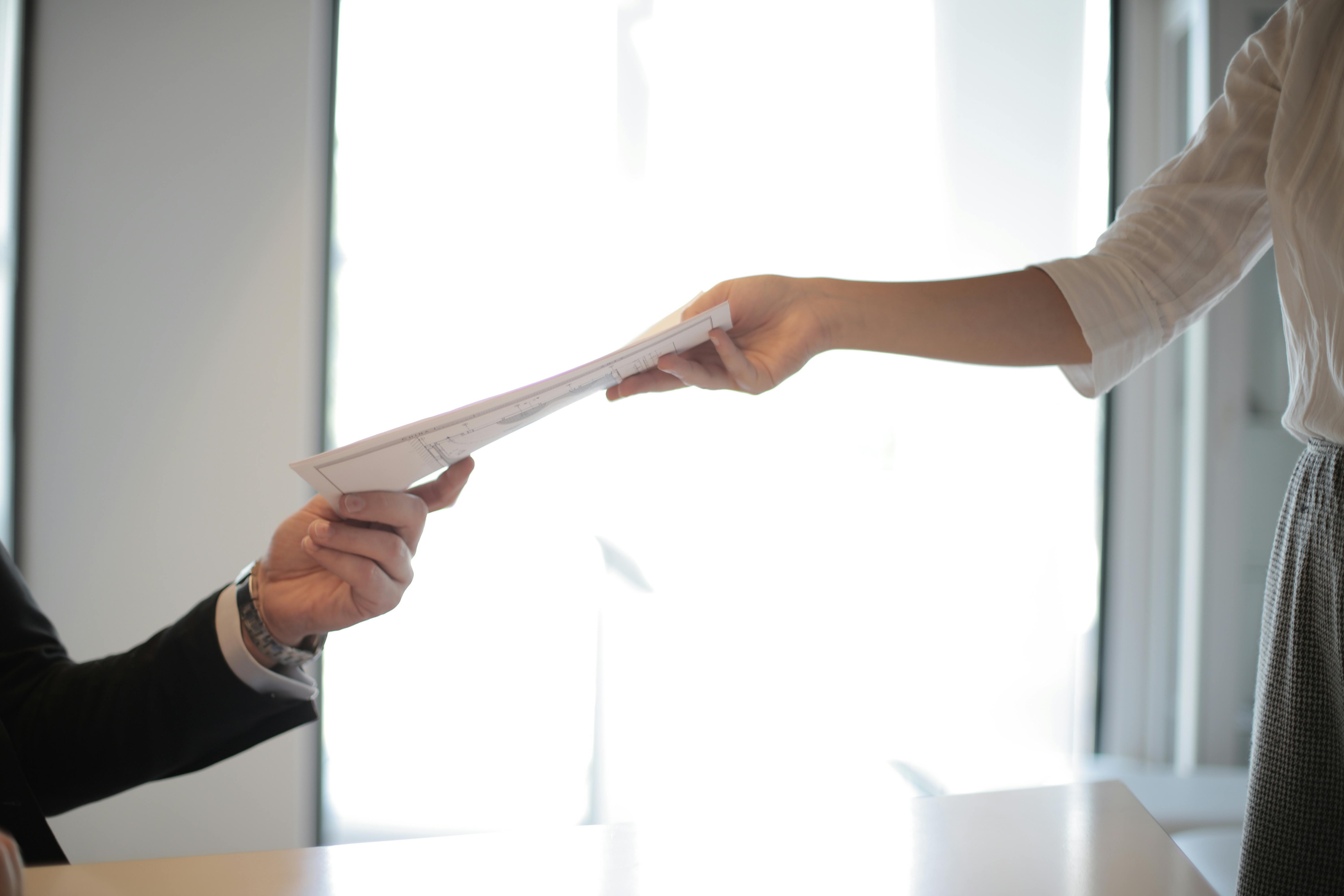 A woman receiving confidential documents | Source: Pexels